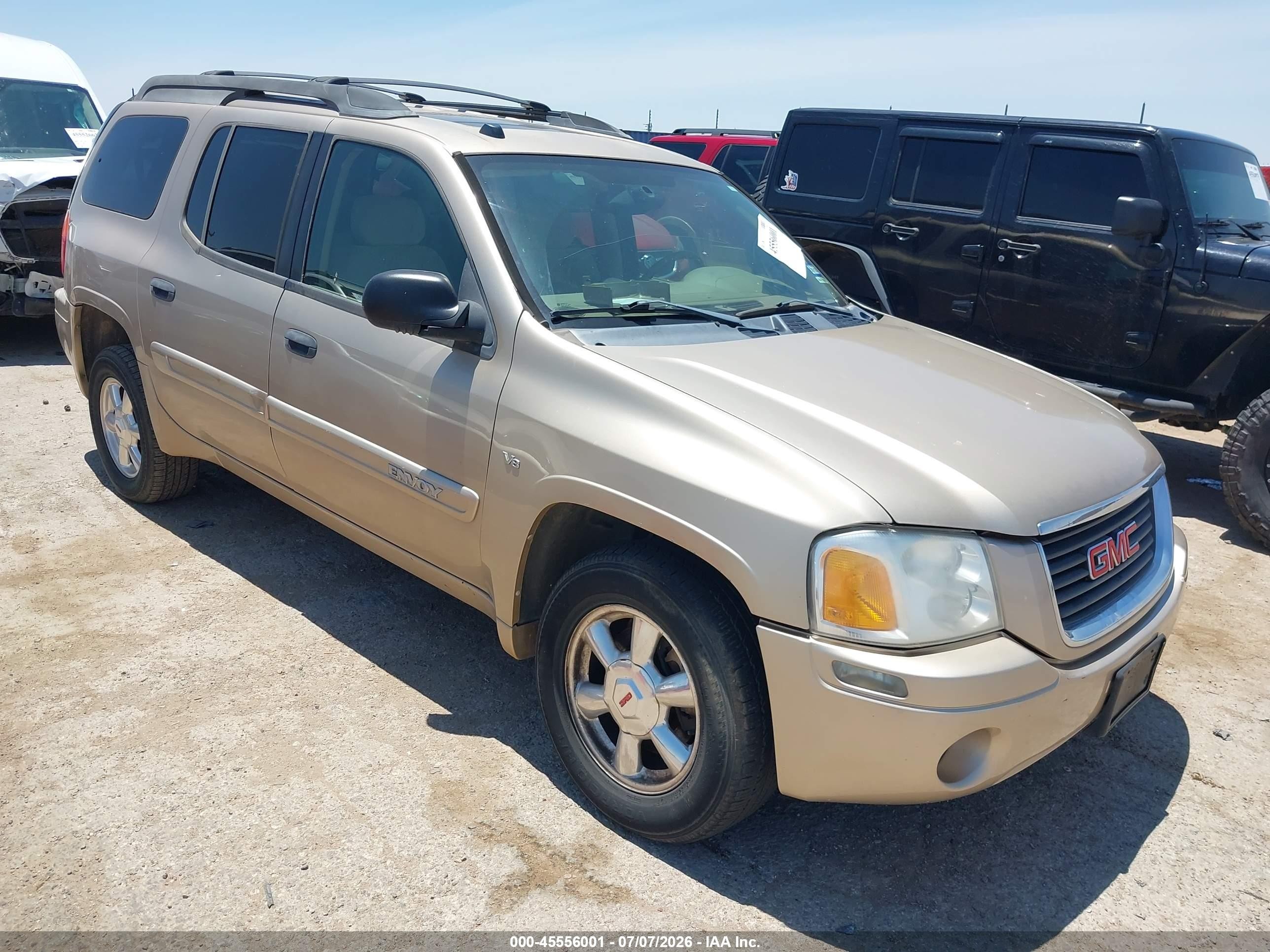 2004 GMC Envoy SLT, VIN 1GKES16P946218147 — Side