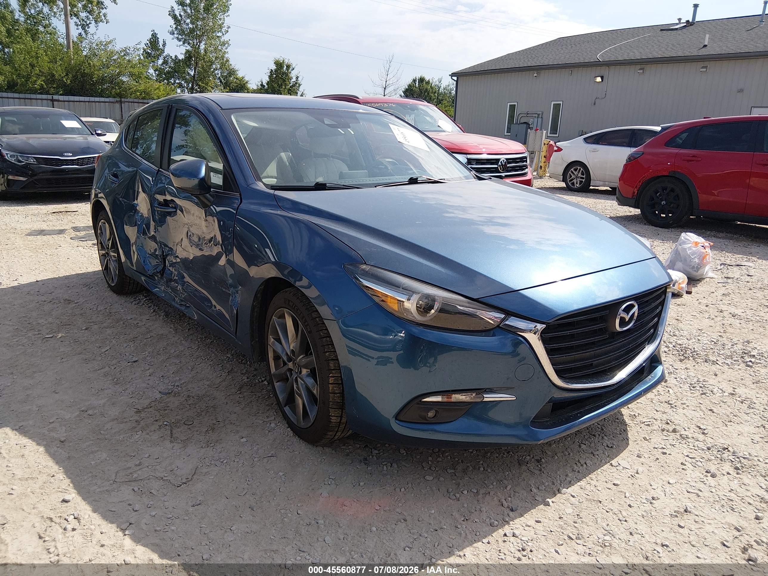 2018 Mazda 3 Grand Touring, VIN 3MZBN1M37JM161123 — Side