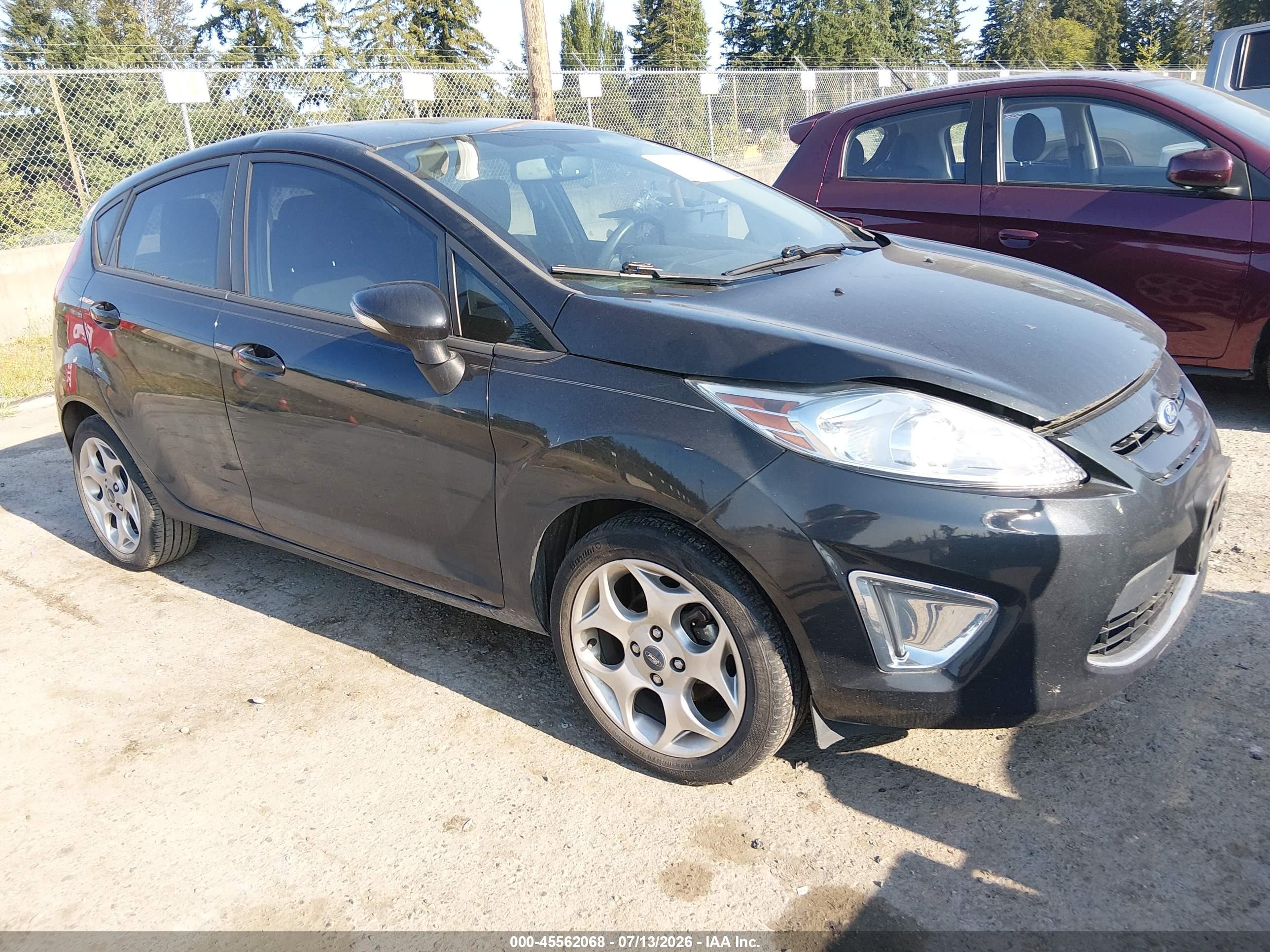 2011 Ford Fiesta SES, VIN 3FADP4FJ2BM189650 — Normal wear