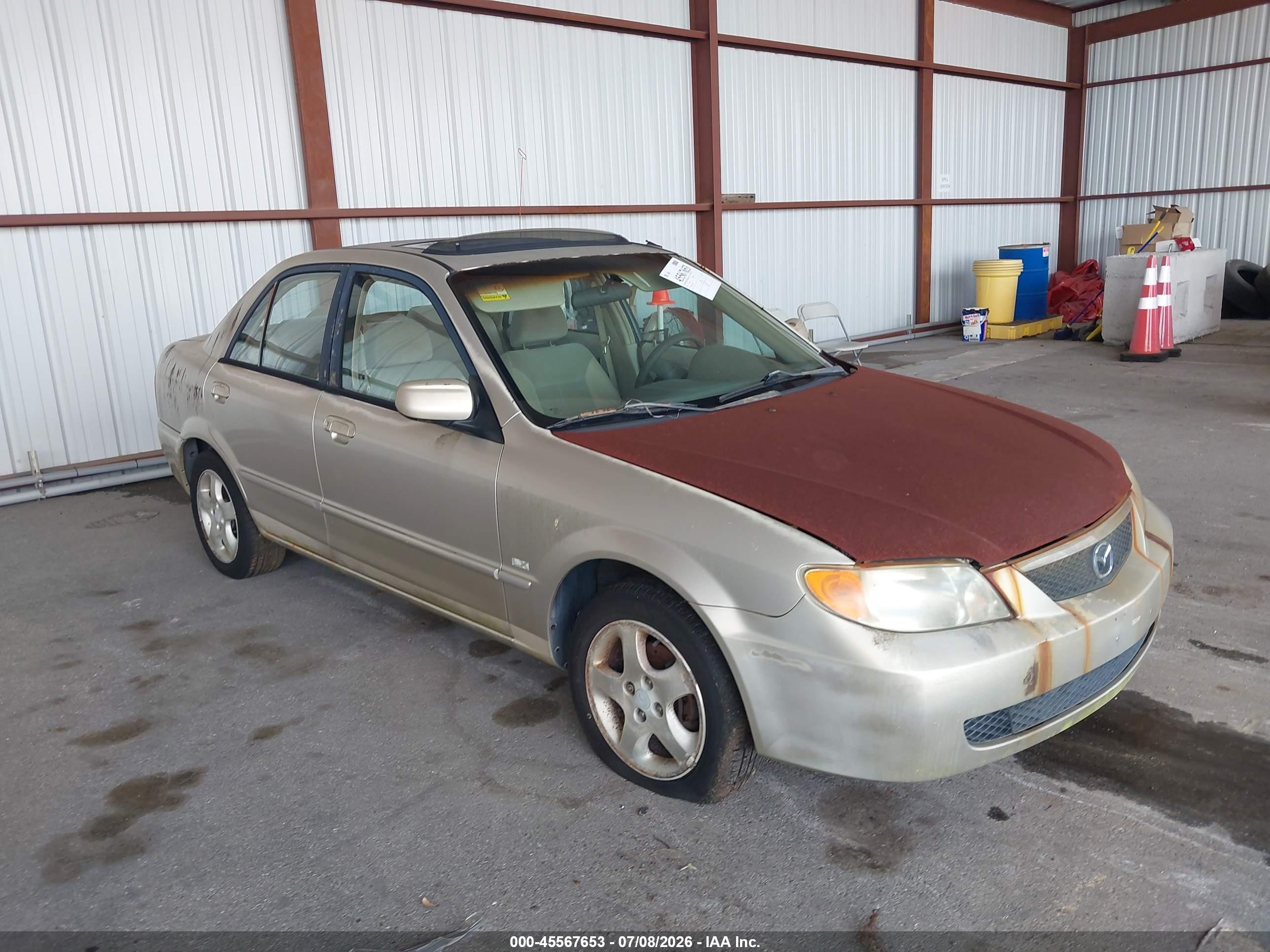 2002 Mazda Protege DX, VIN JM1BJ225821588592 — Normal wear