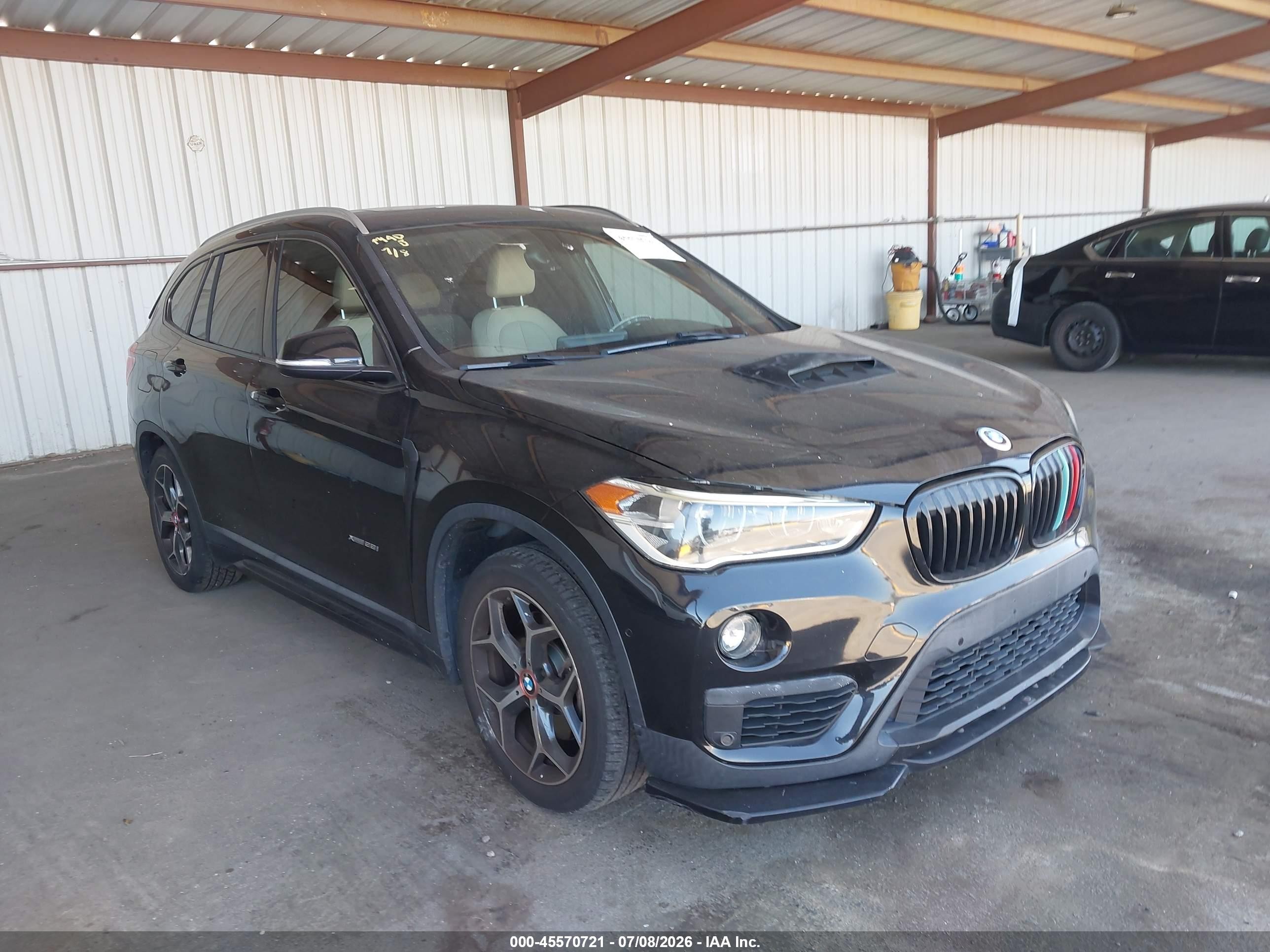 2016 BMW X1 xDrive28i, VIN WBXHT3C33G5E50164 — Rear end