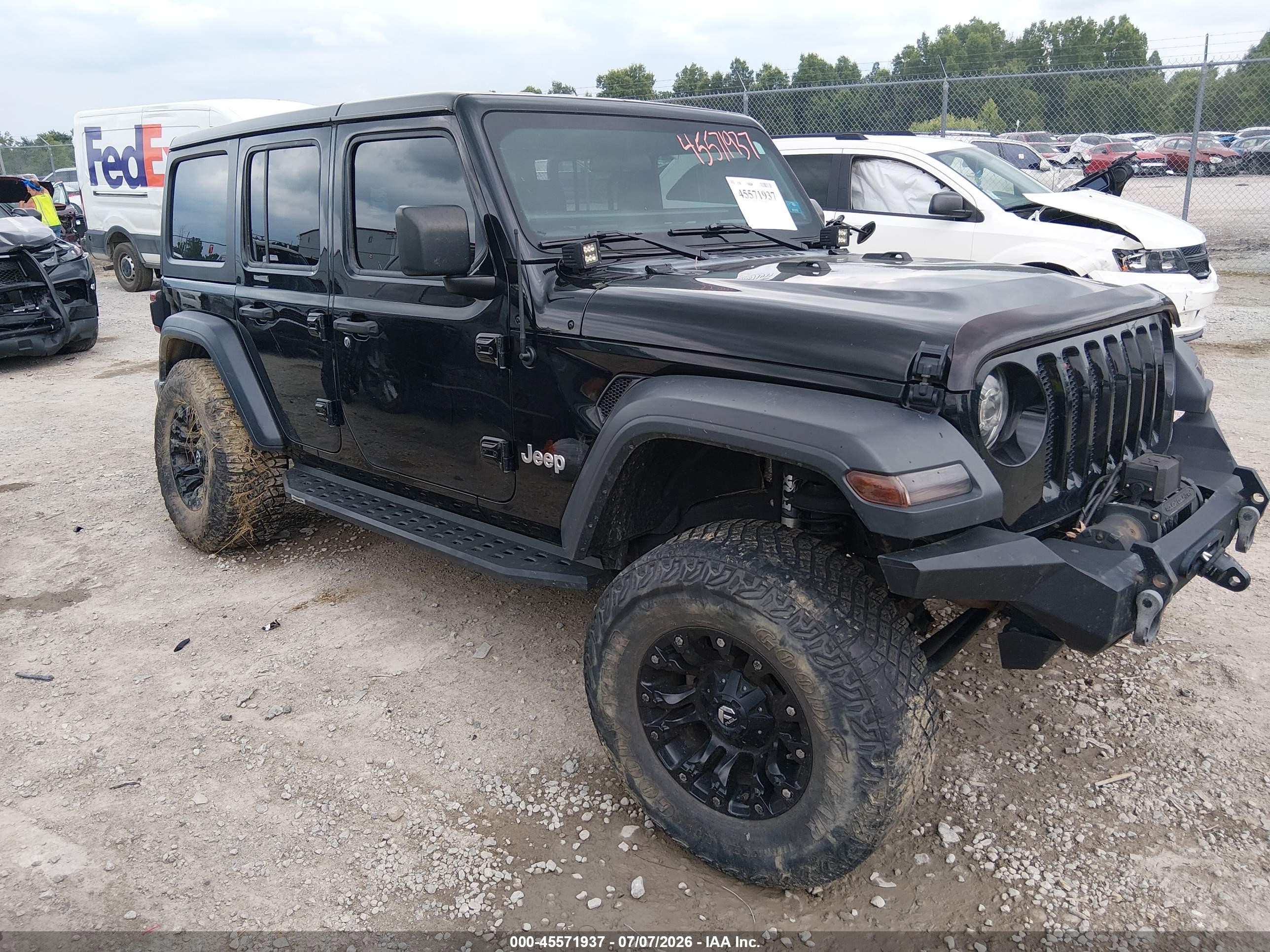 2019 Jeep Wrangler Unlimited Sport S, VIN 1C4HJXDG8KW557125 — Side