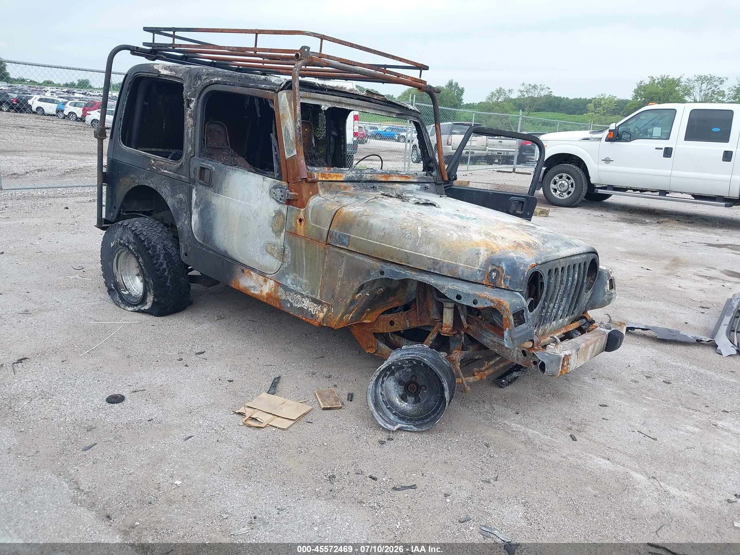 1999 Jeep Wrangler Sport, VIN 1J4FY19S0XP466312 — Пожар