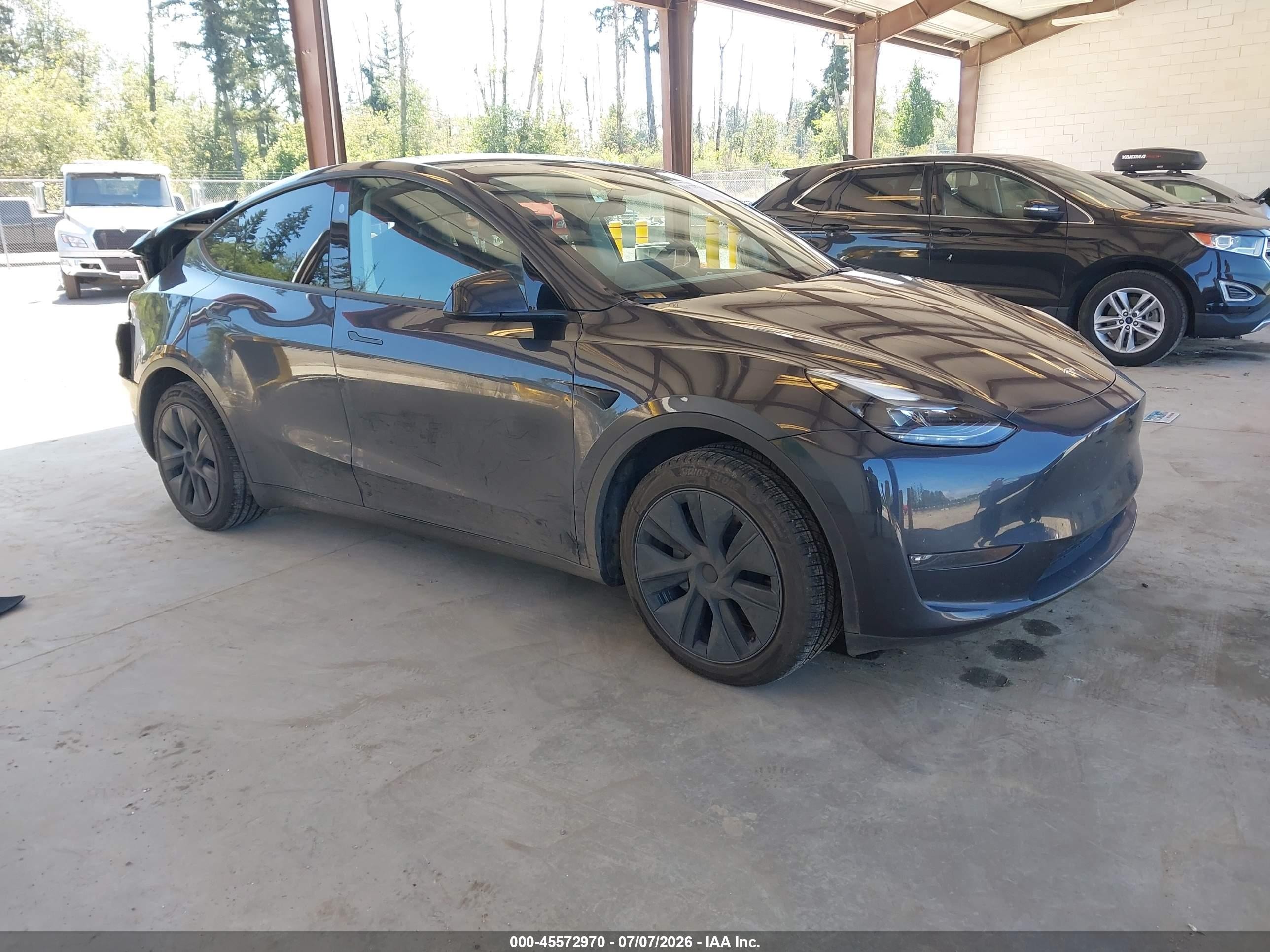2024 Tesla Model Y Long Range, VIN 7SAYGAEE8RF170164 — Rear end