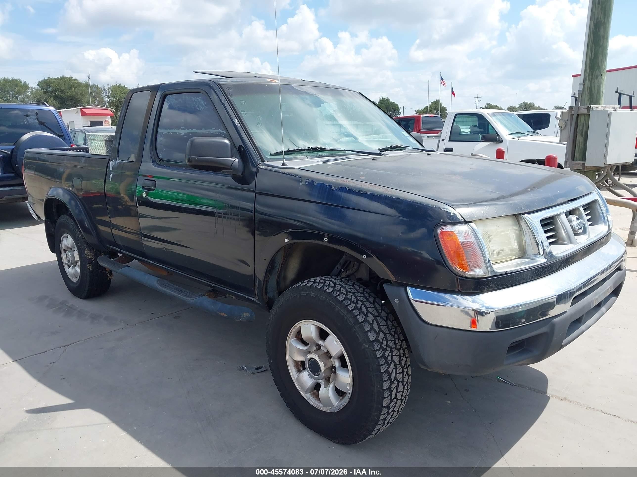 1999 Nissan Frontier XE, VIN 1N6ED26Y0XC312750 — Normal wear