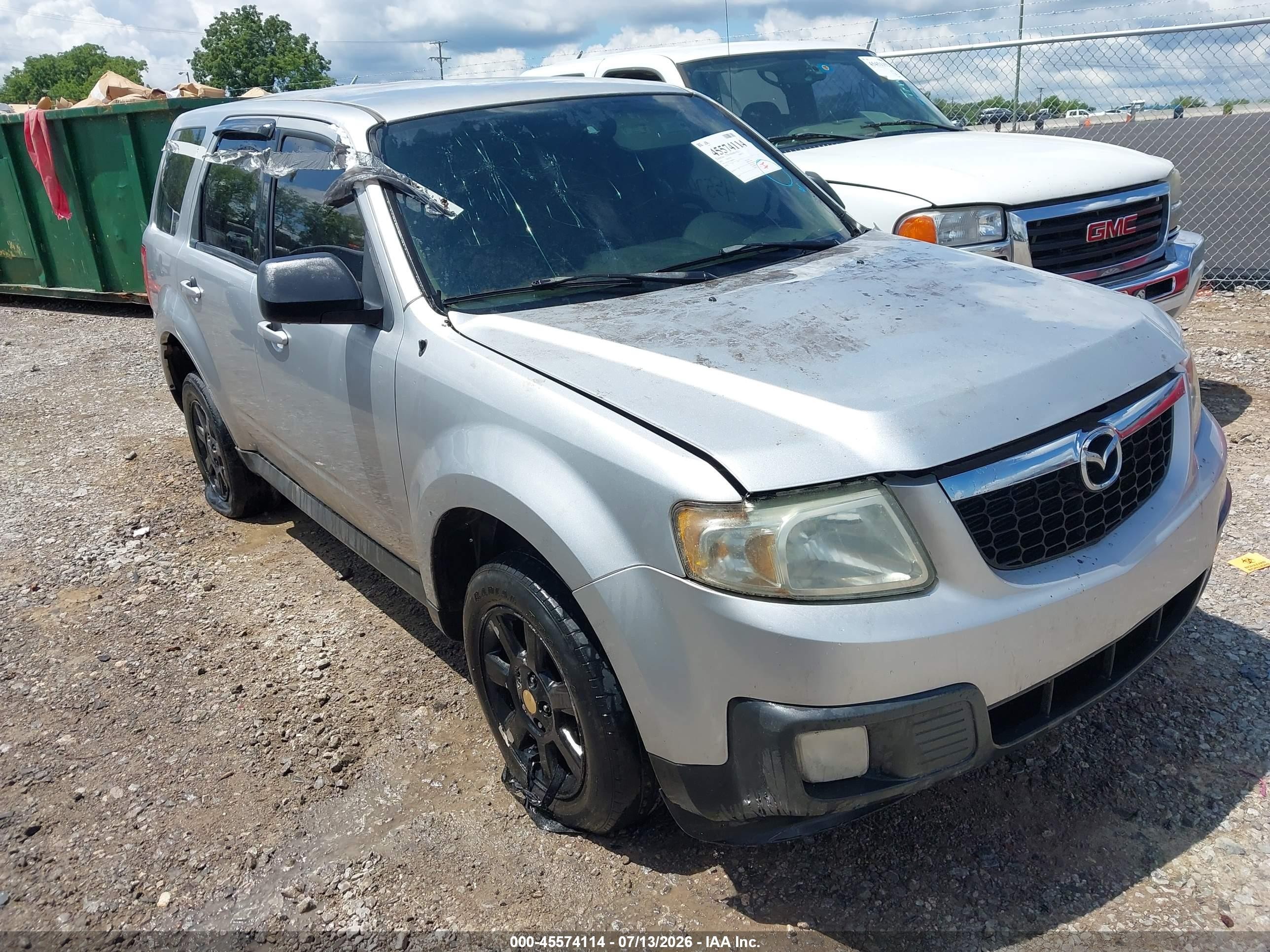 2010 Mazda Tribute Touring, VIN 4F2CY0C79AKM00059 — Normal wear
