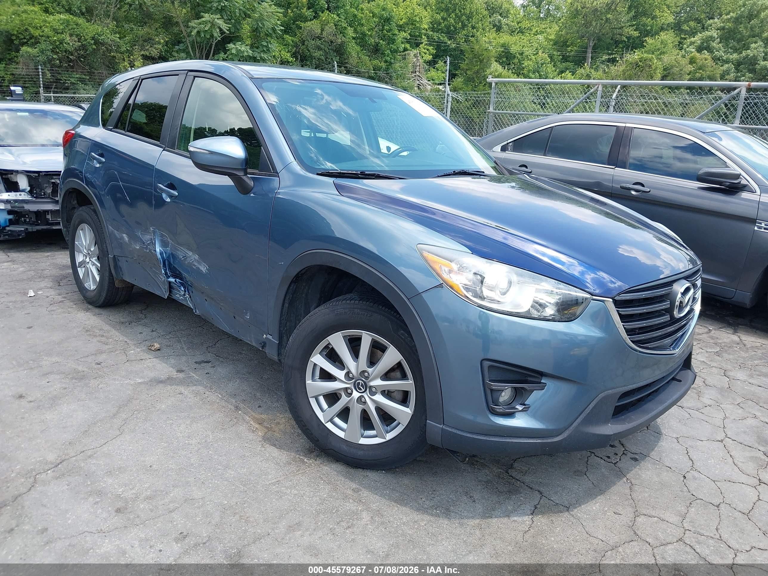 2016 Mazda CX-5 Touring, VIN JM3KE2CY1G0677437 — Side