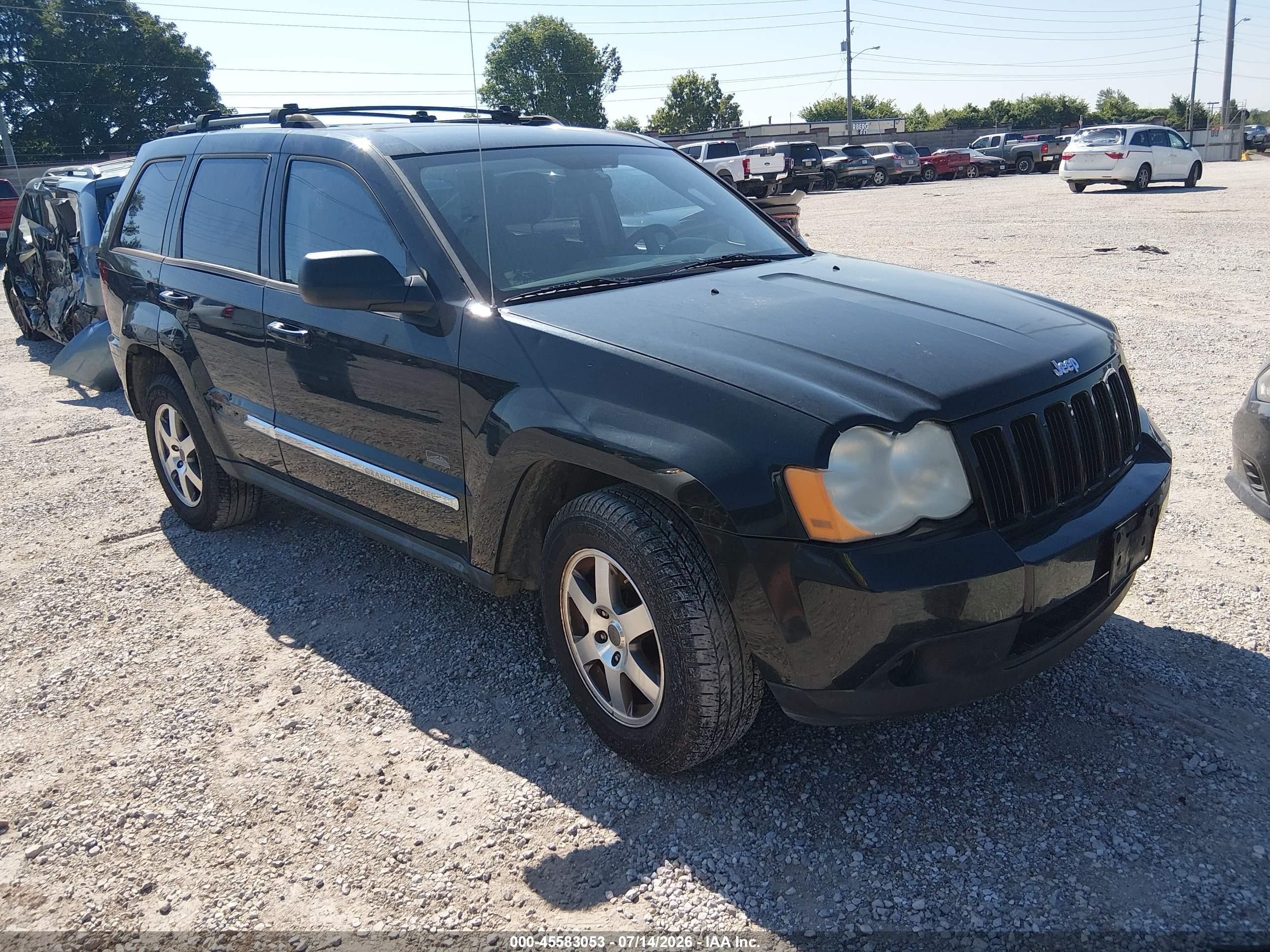 2009 Jeep Grand Cherokee Laredo, VIN 1J8GR48K09C552233 — Side
