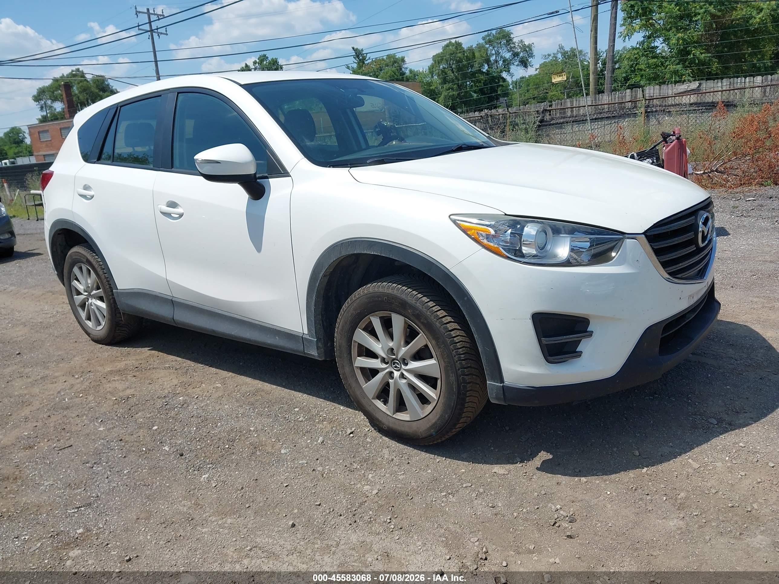 2016 Mazda CX-5 Sport, VIN JM3KE4BY6G0891143 — Side