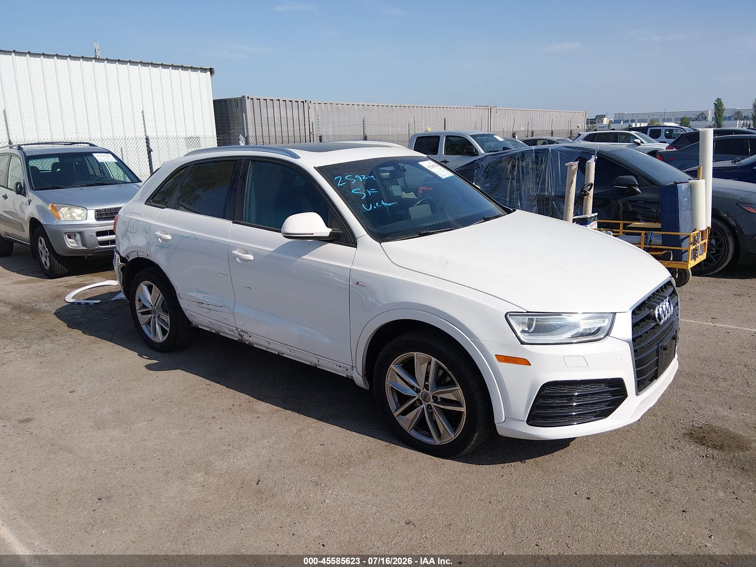 2018 Audi Q3 Premium, VIN WA1BCCFS4JR024044 — Side
