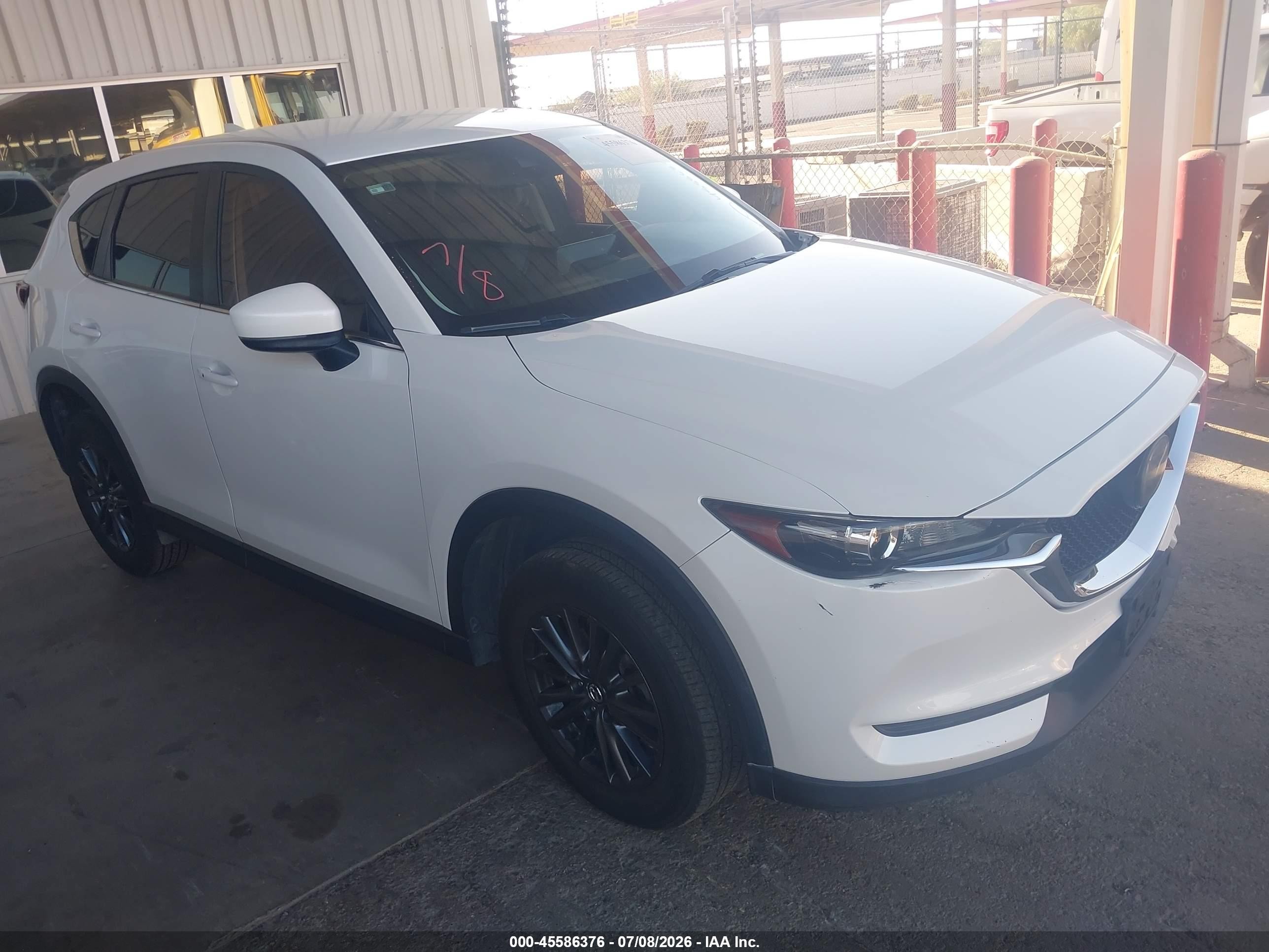2021 Mazda CX-5 Touring, VIN JM3KFACM1M0385156 — Front end