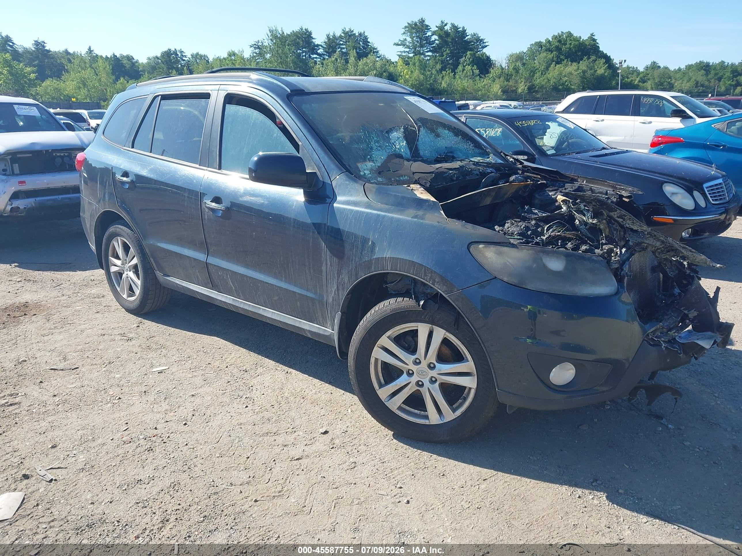 2012 Hyundai Santa Fe Limited, VIN 5XYZKDAGXCG148952 — Engine fire