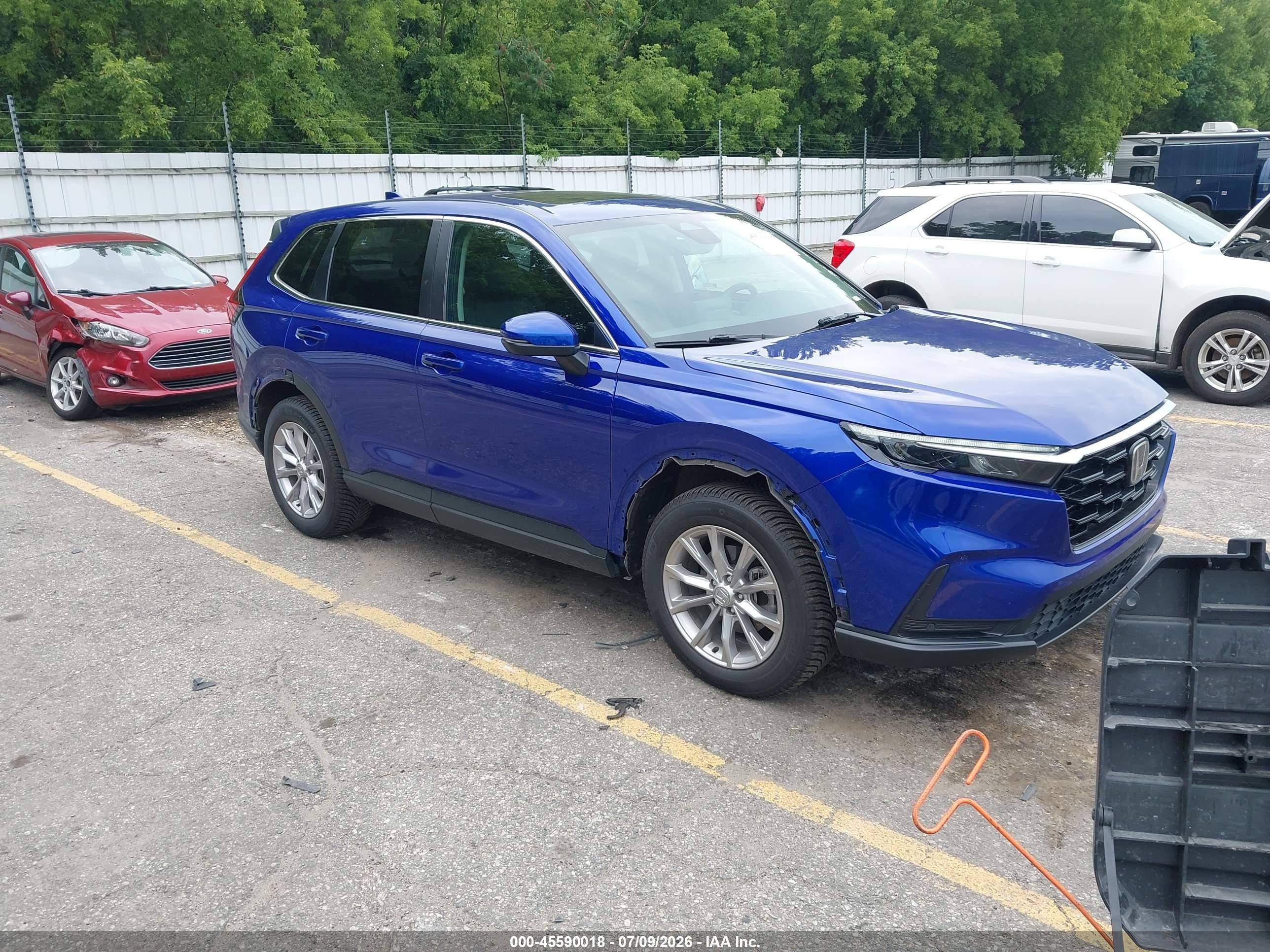 2023 Honda CR-V EX-L, VIN 2HKRS4H73PH410010 — Бок