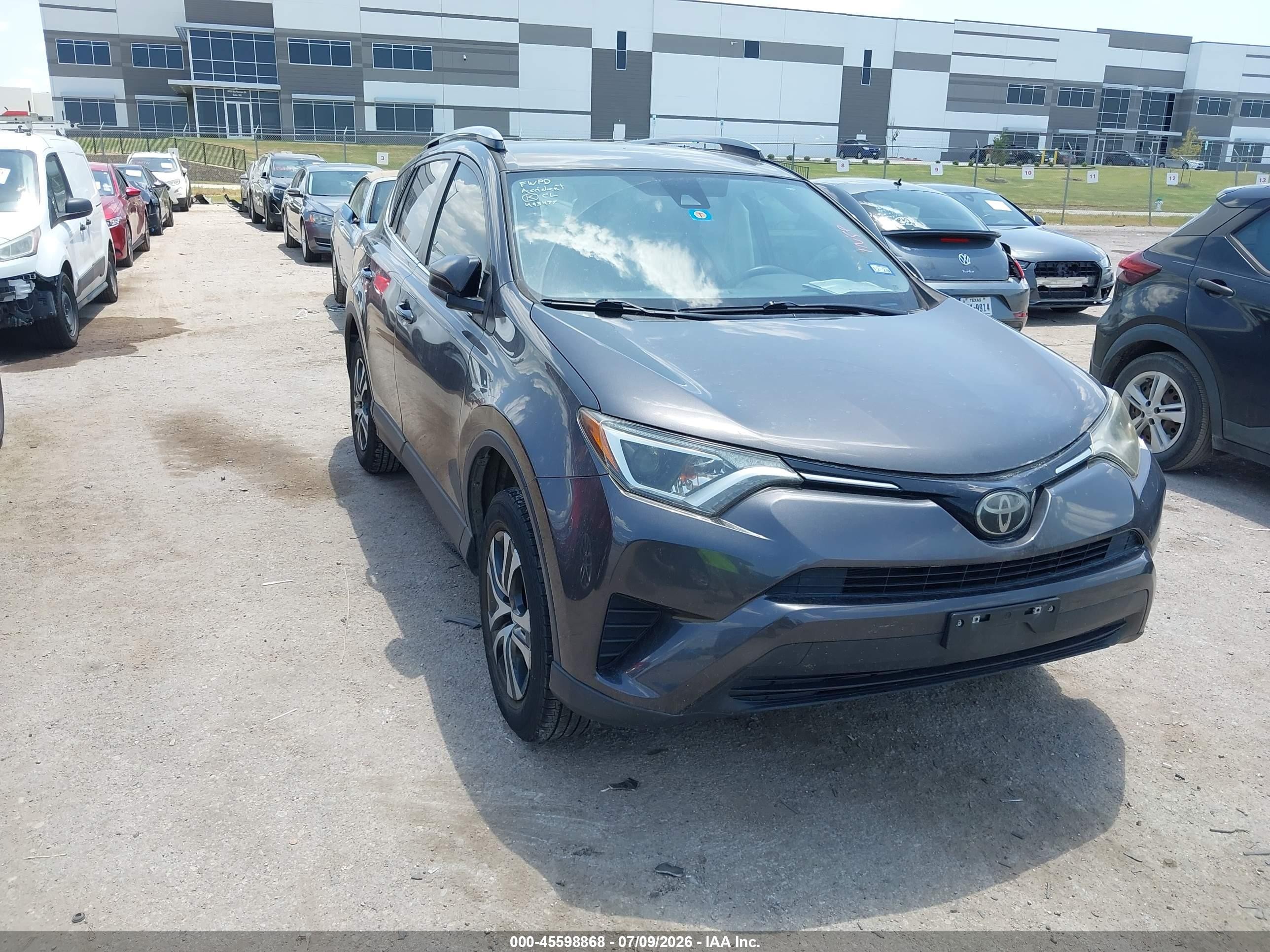 2018 Toyota RAV4 LE, VIN JTMZFREV9JJ209120 — Side