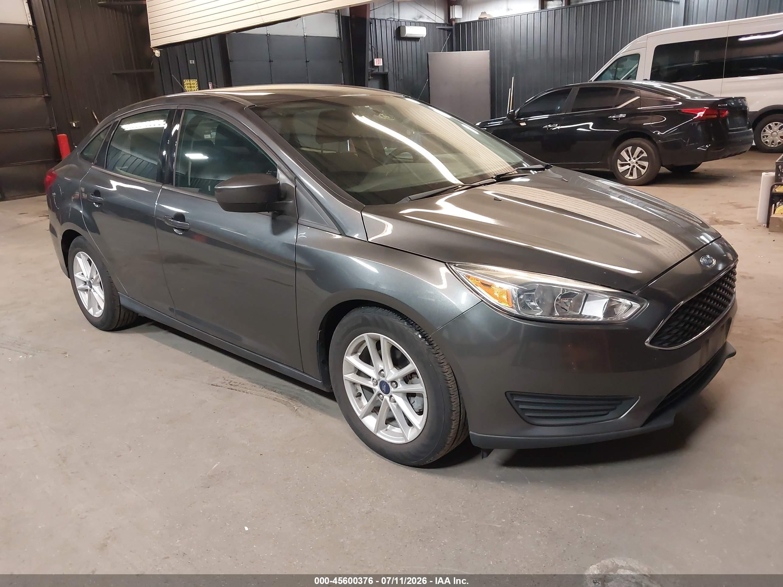 2018 Ford Focus SE, VIN 1FADP3F24JL328230 — Normal wear