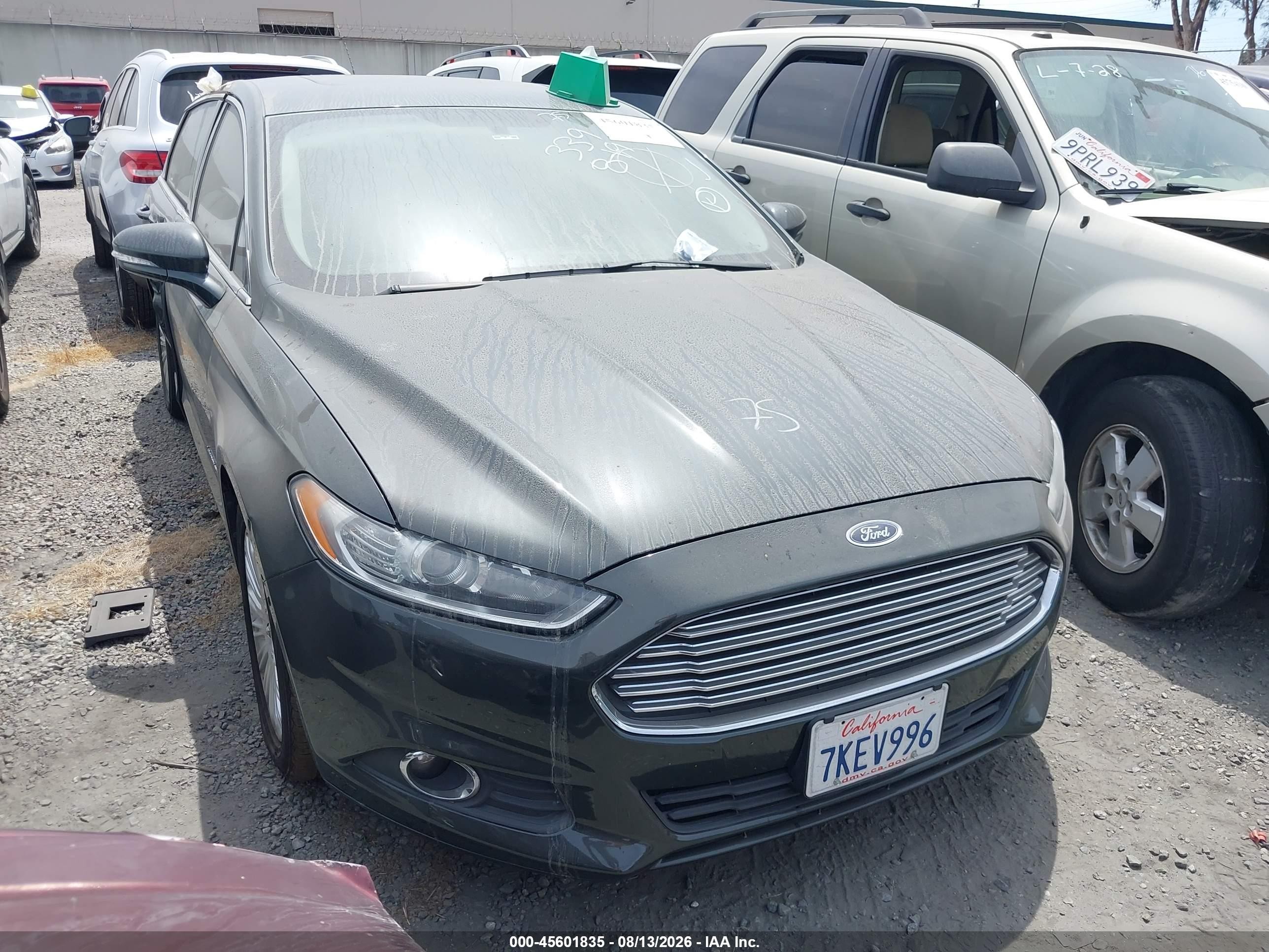 2015 Ford Fusion SE Hybrid, VIN 3FA6P0LU9FR105445 — Side