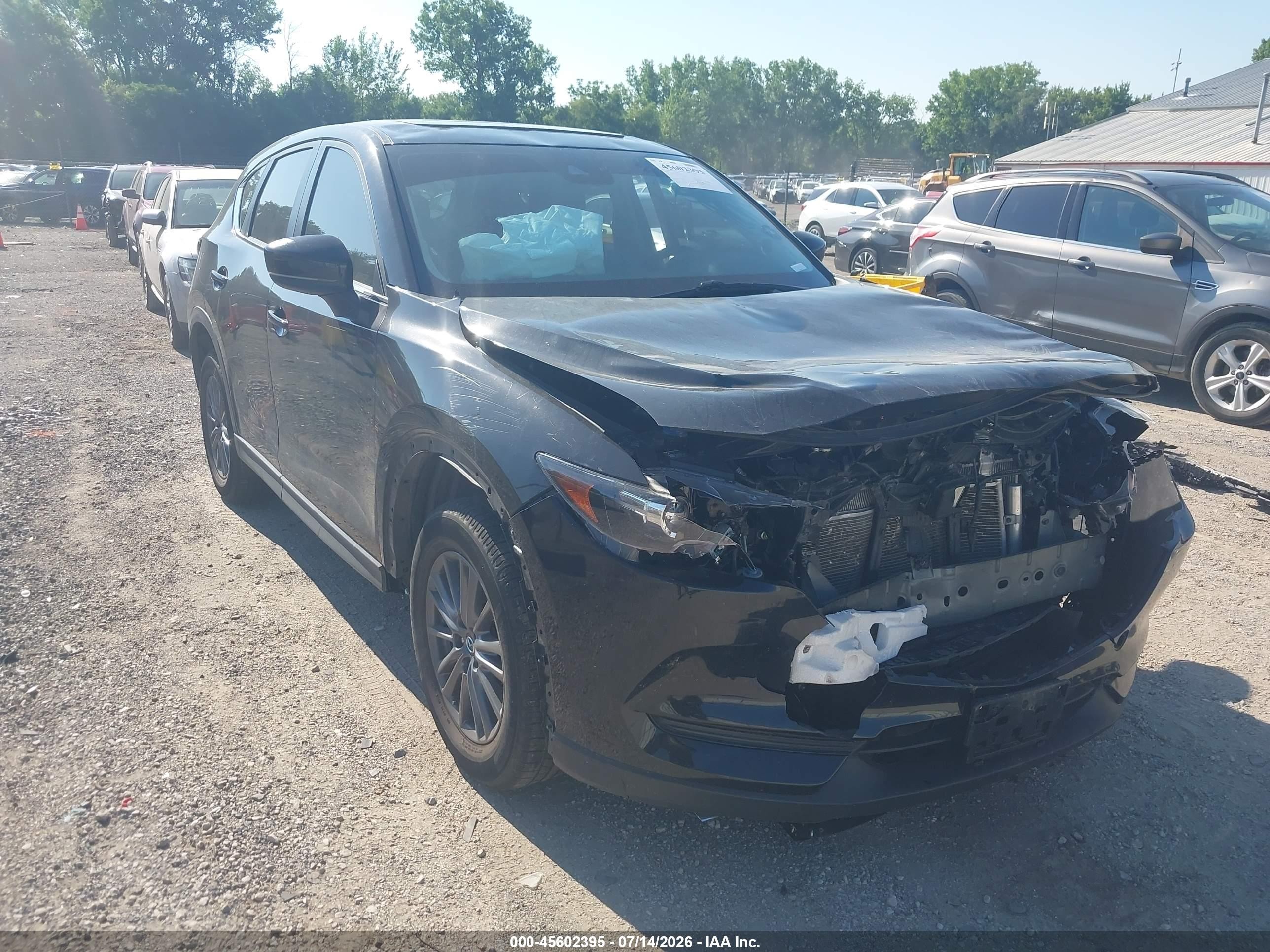 2021 Mazda CX-5 Touring, VIN JM3KFACM9M1329086 — Front end