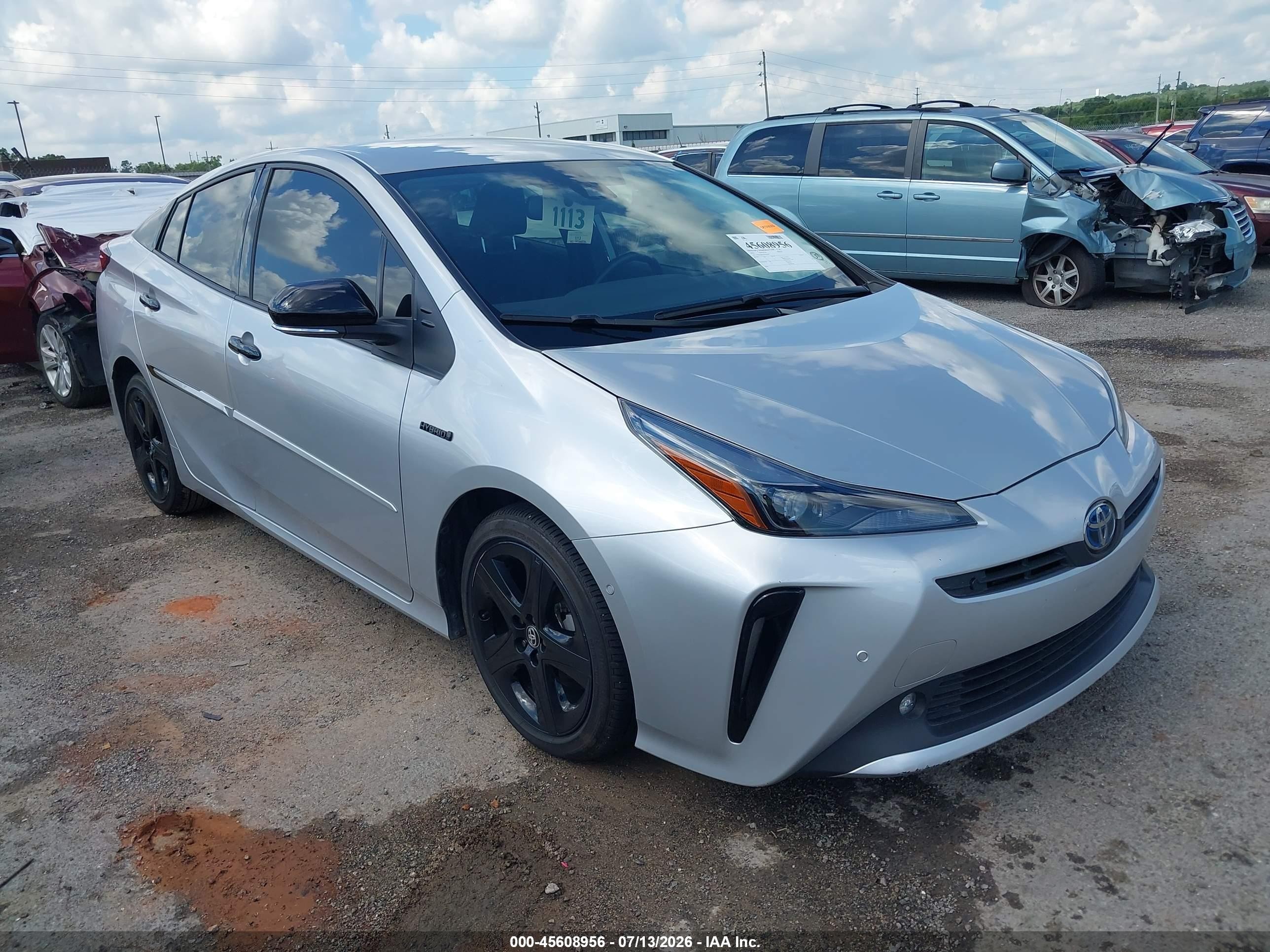 2022 Toyota Prius L Eco, VIN JTDKAMFU3N3161939 — Бок