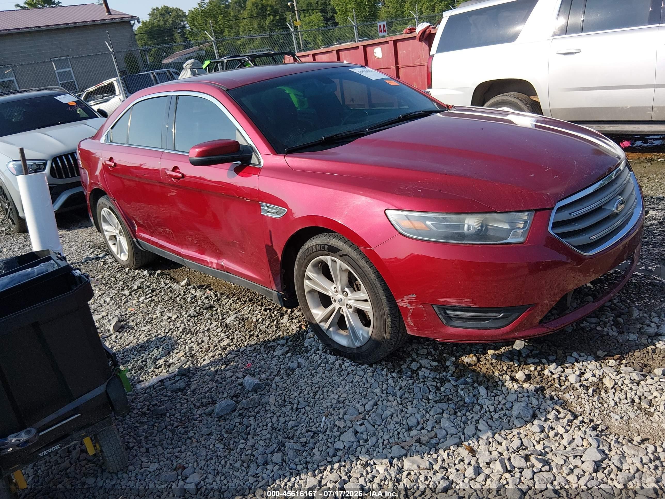 2015 Ford Taurus SEL, VIN 1FAHP2E8XFG174706 — Side