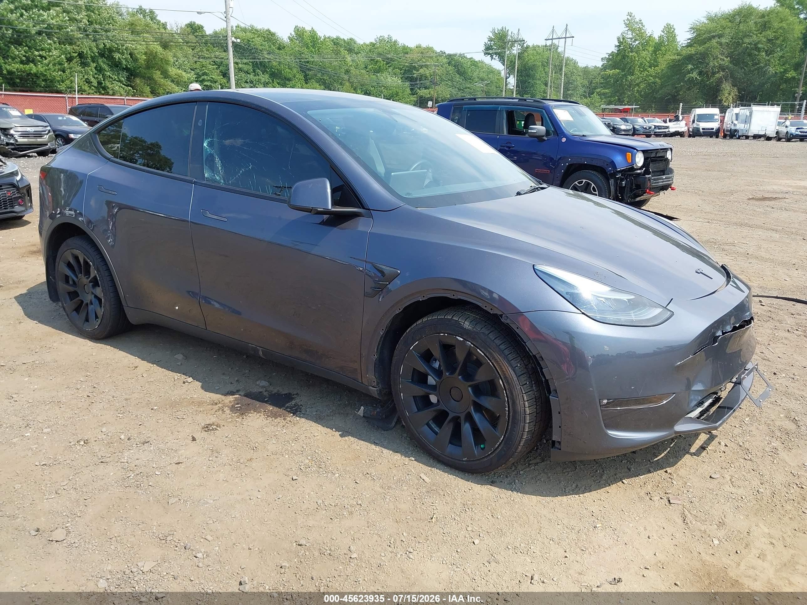 2023 Tesla Model Y Long Range, VIN 7SAYGDEE4PF861741 — Side