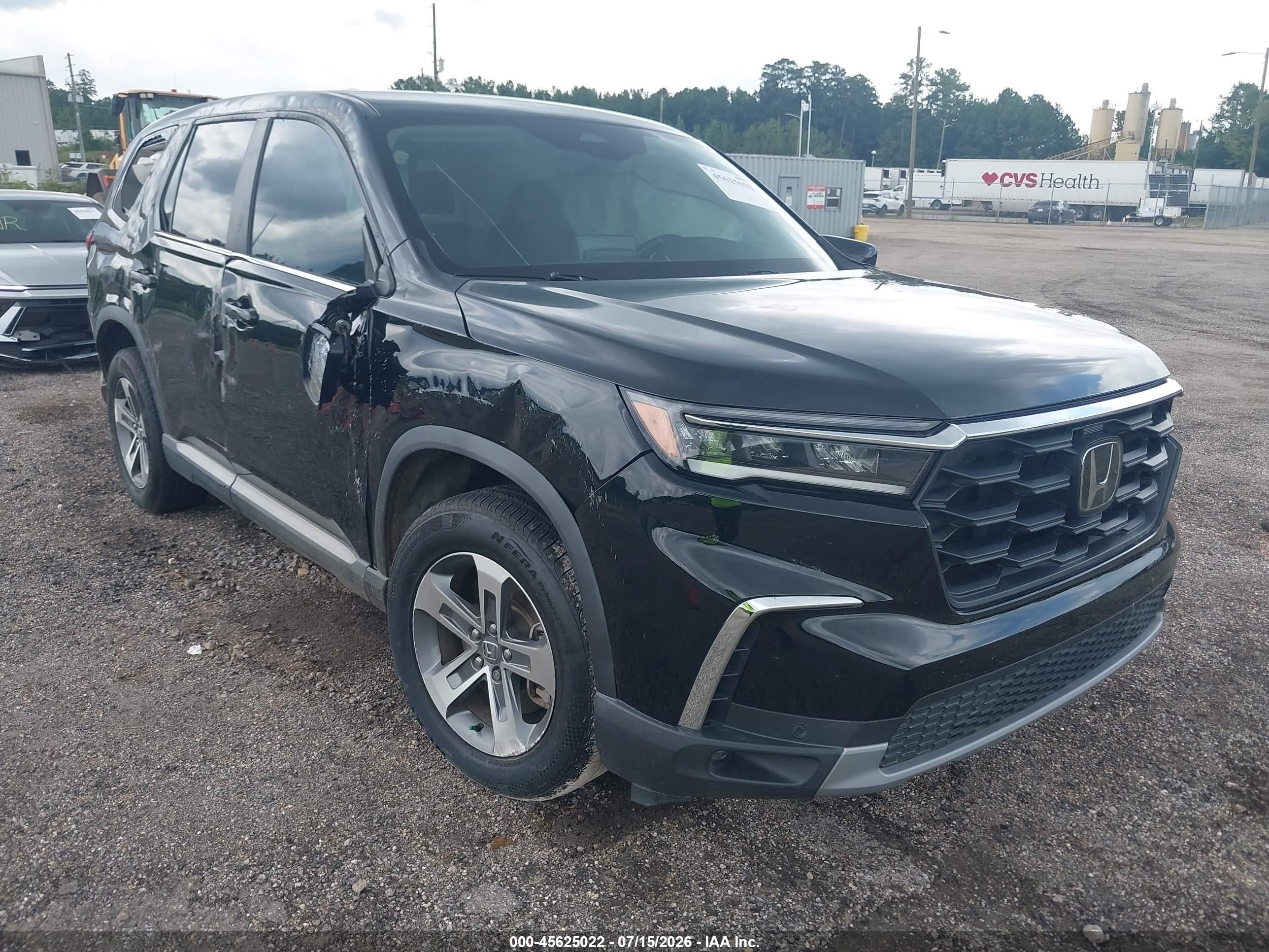 2023 Honda Pilot EX-L, VIN 5FNYG2H45PB002050 — Бок
