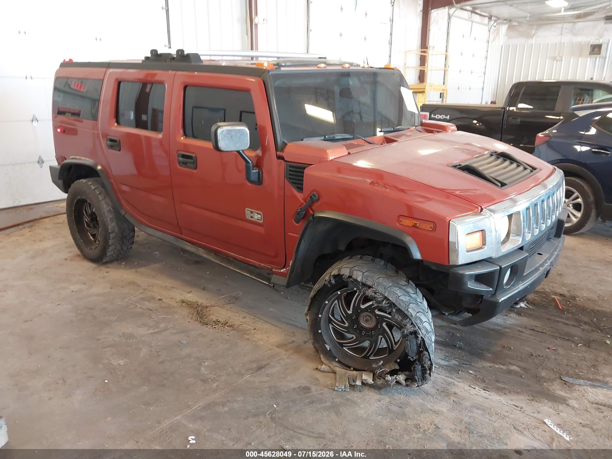 2003 Hummer H2, VIN 5GRGN23UX3H147733 — Undercarriage