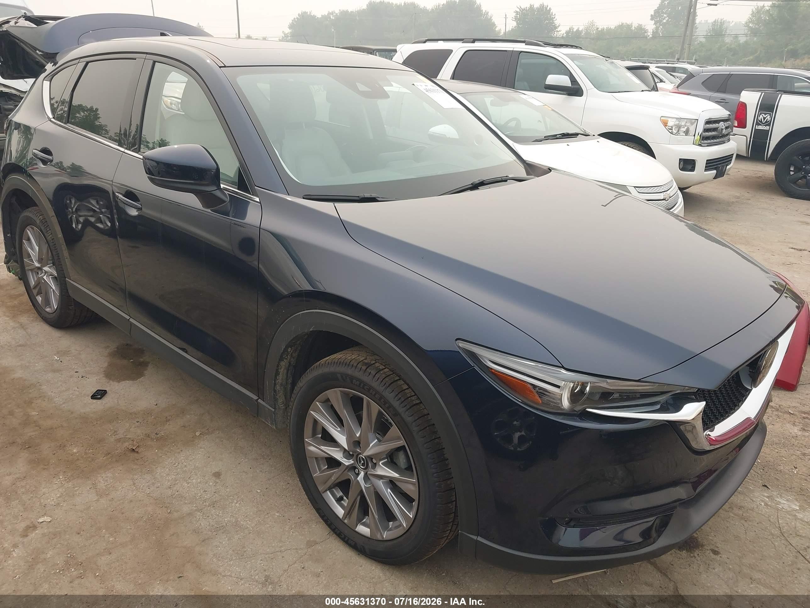 2020 Mazda CX-5 Grand Touring, VIN JM3KFBDM0L1853049 — Rear end
