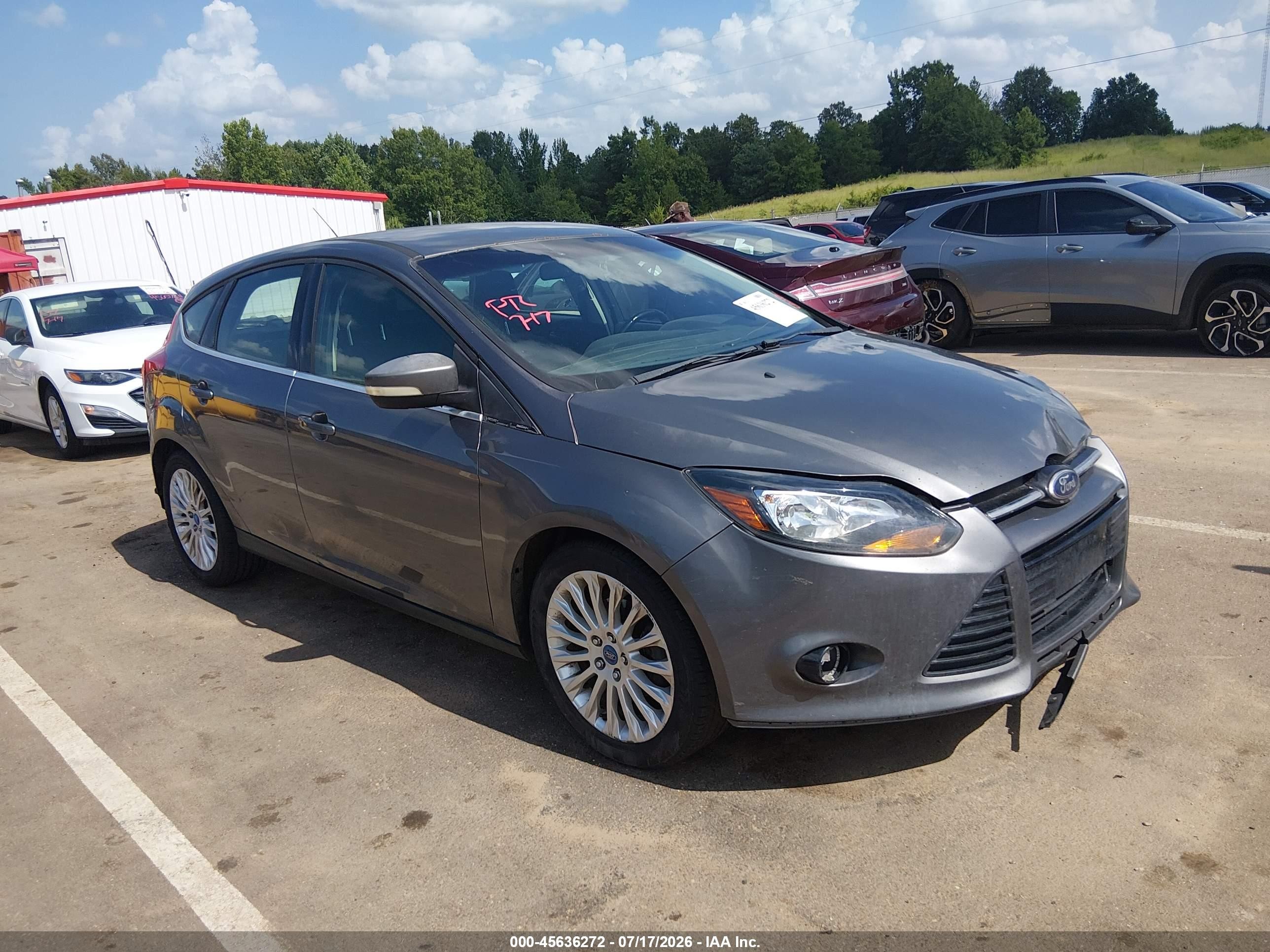 2012 Ford Focus Titanium, VIN 1FAHP3N21CL144966 — Side