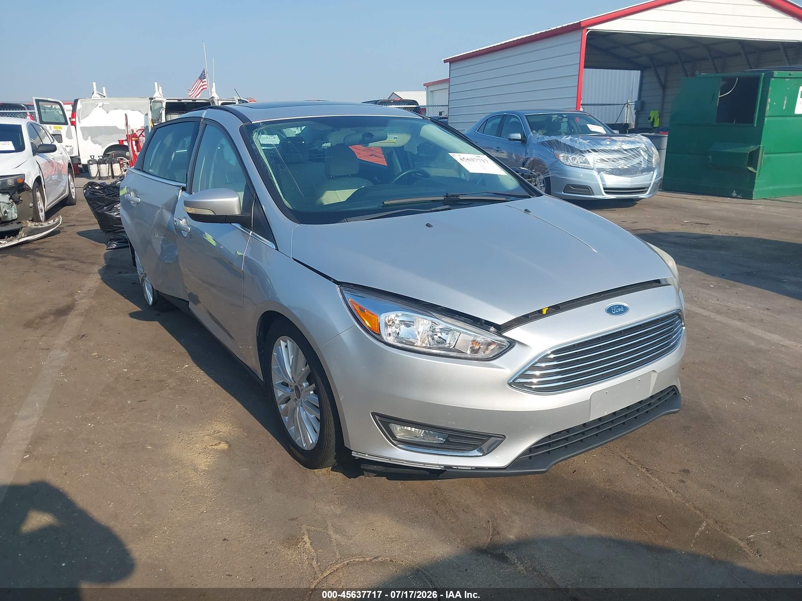 2017 Ford Focus Titanium, VIN 1FADP3J21HL238860 — Side