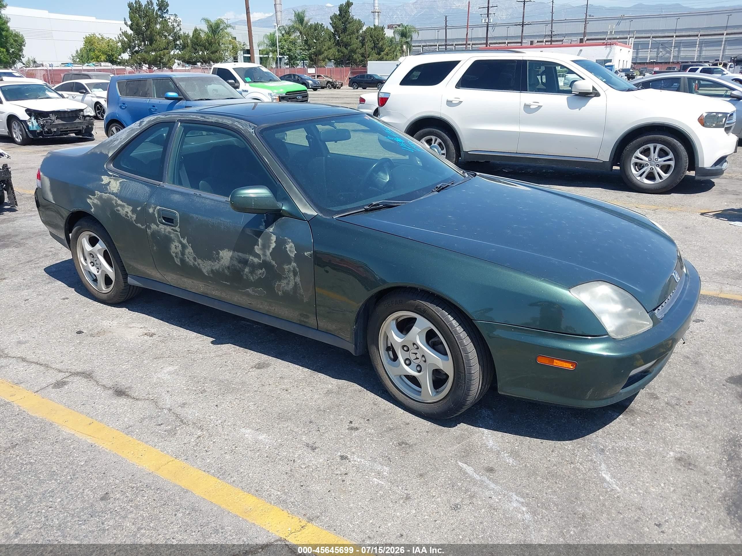 1999 Honda Prelude, VIN JHMBB6241XC009402 — Бок