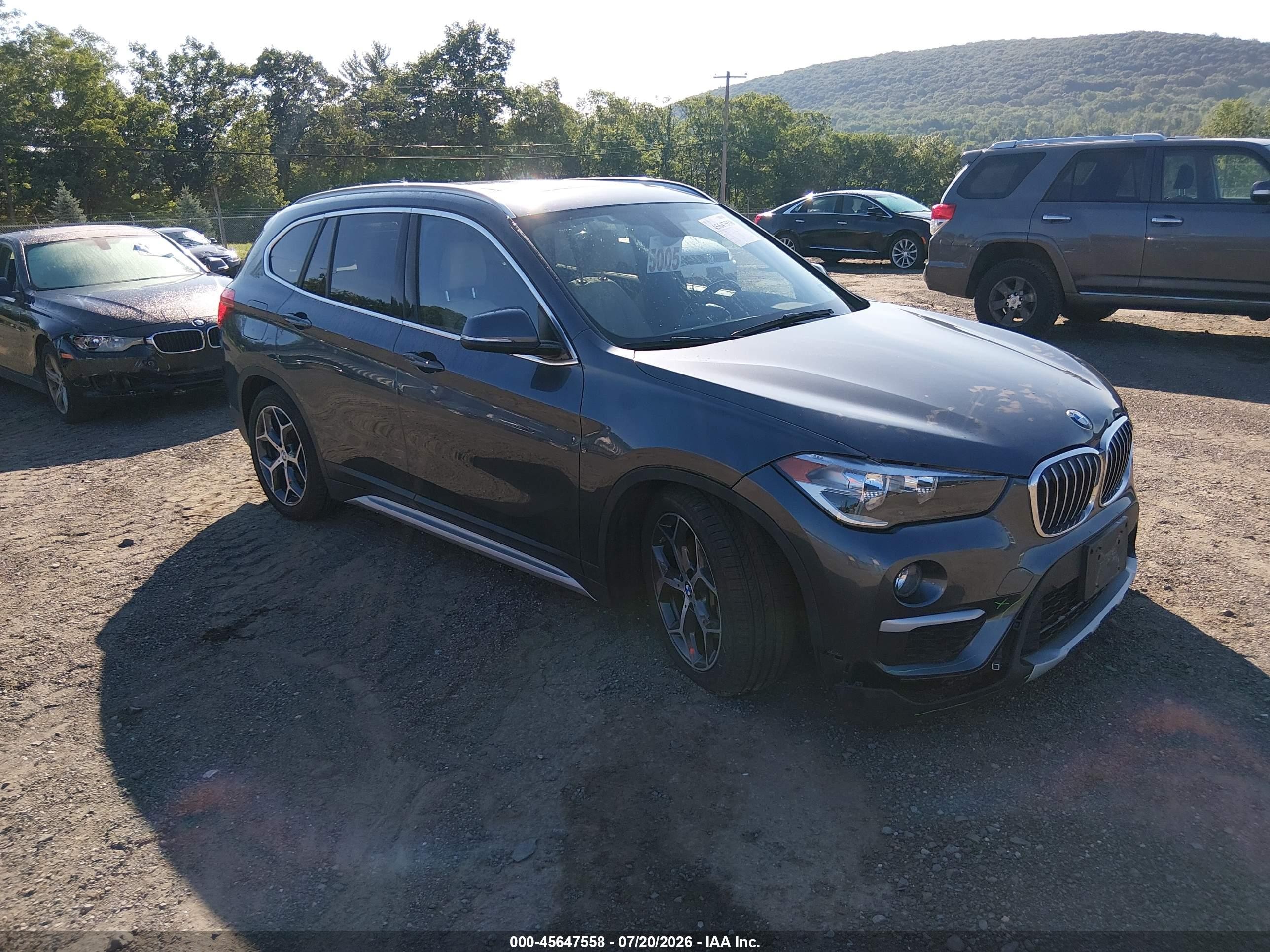 2018 BMW X1 xDrive28i, VIN WBXHT3C36J5L34705 — Front end