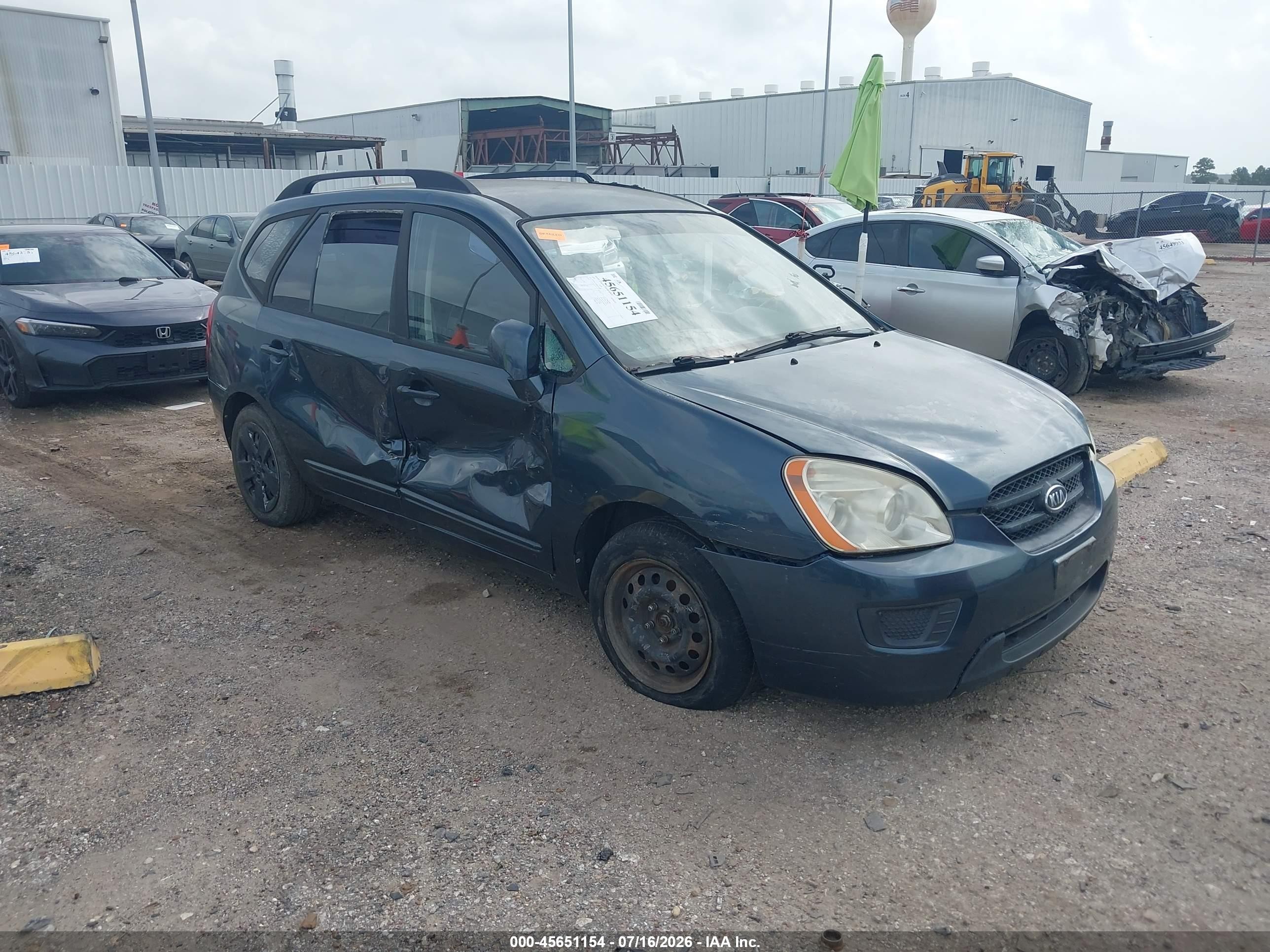 2009 Kia Rondo LX, VIN KNAFG528897238105 — Бок