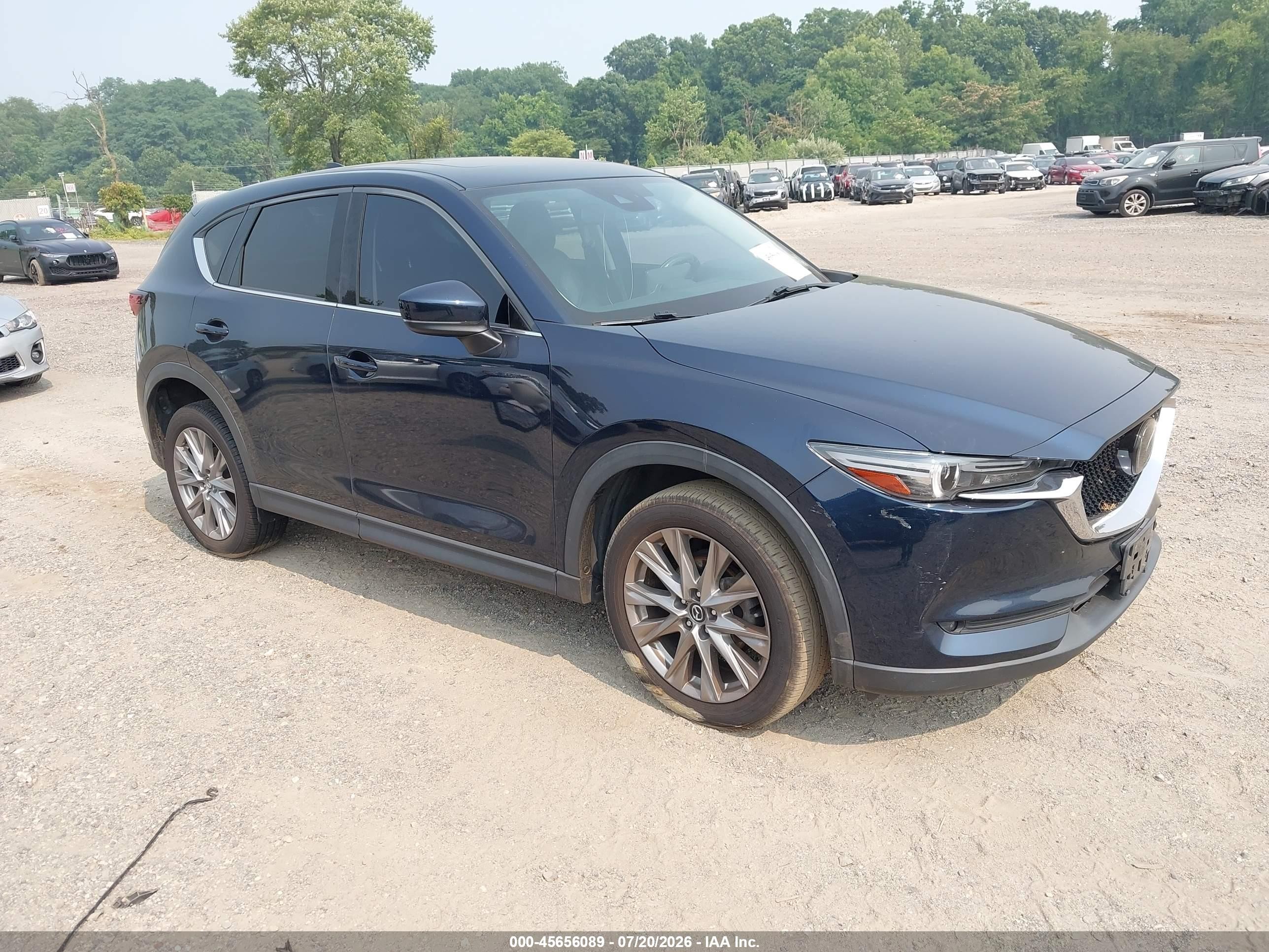 2021 Mazda CX-5 Grand Touring, VIN JM3KFBDM8M1390014 — Water / flood