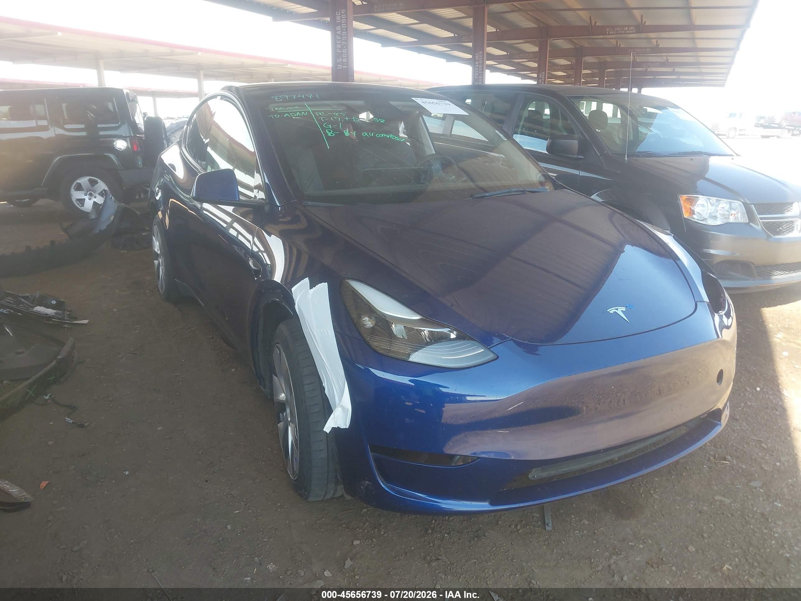 2023 Tesla Model Y Long Range, VIN 7SAYGAEE7PF897471 — Not stated