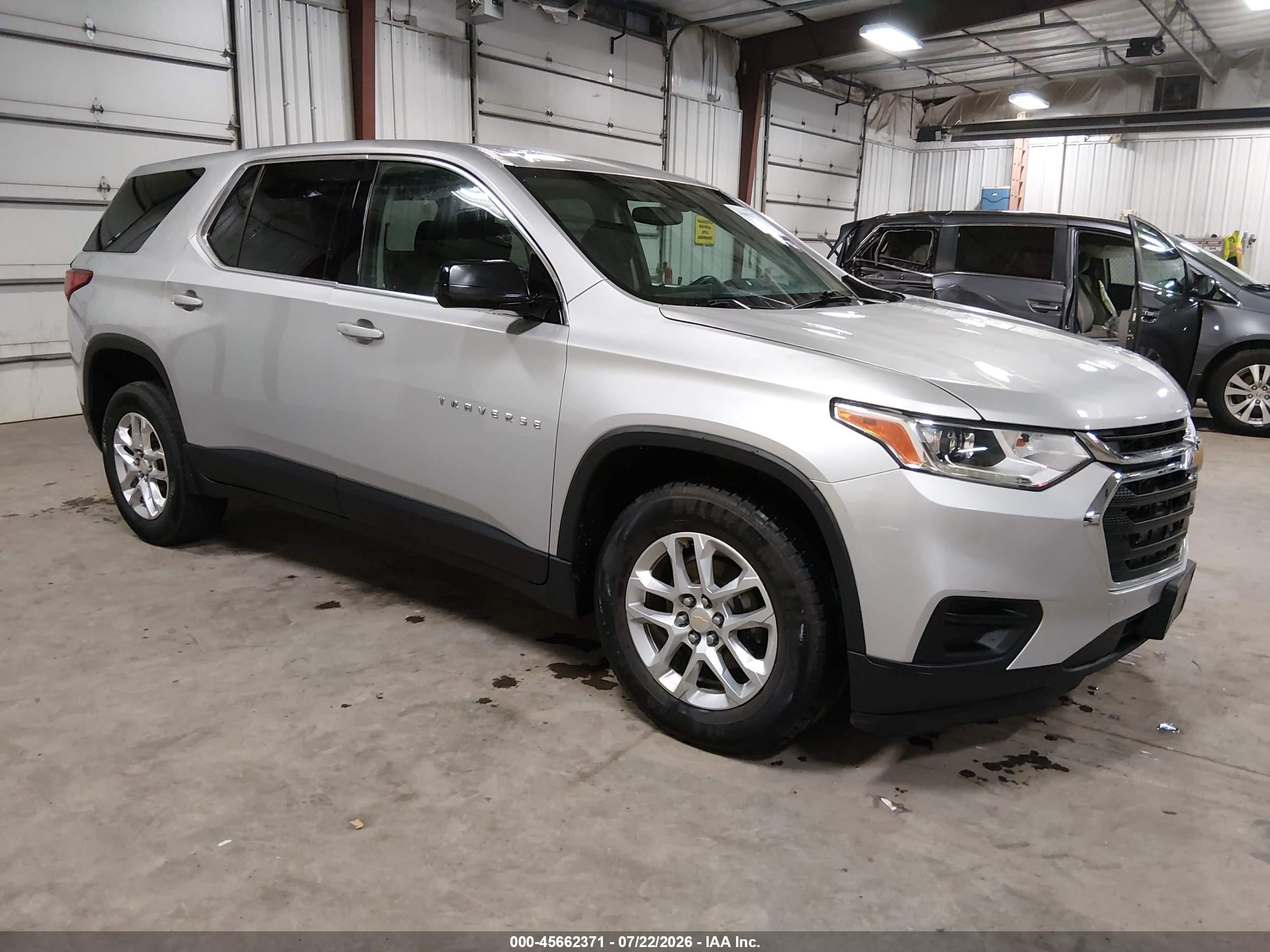 2019 Chevrolet Traverse LS, VIN 1GNEVFKW9KJ214551 — Hail