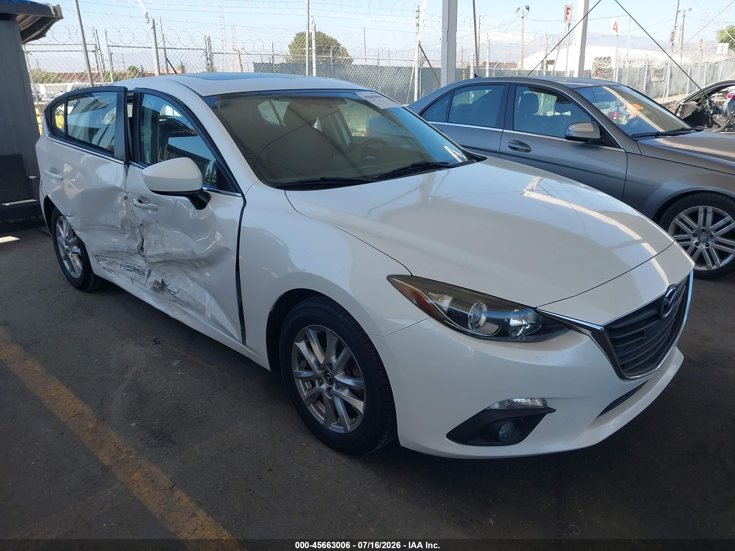 2016 Mazda 3 i Touring, VIN JM1BM1L77G1327978 — Side