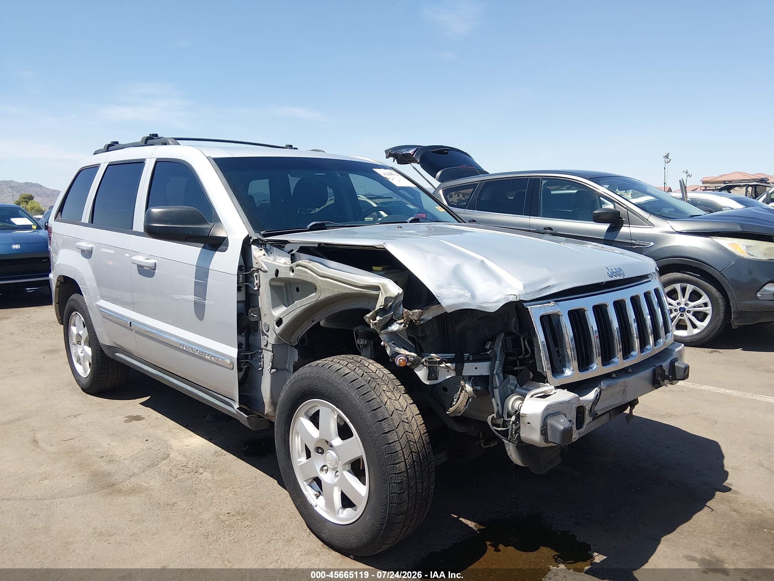 2010 Jeep Grand Cherokee Laredo, VIN 1J4PR4GK3AC147801 — Front end
