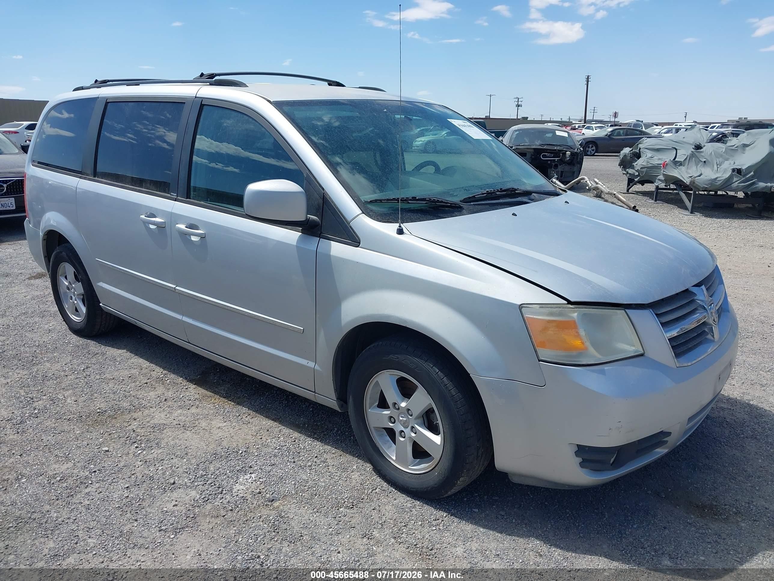2010 Dodge Grand Caravan SXT, VIN 2D4RN5D12AR209582 — Normal wear