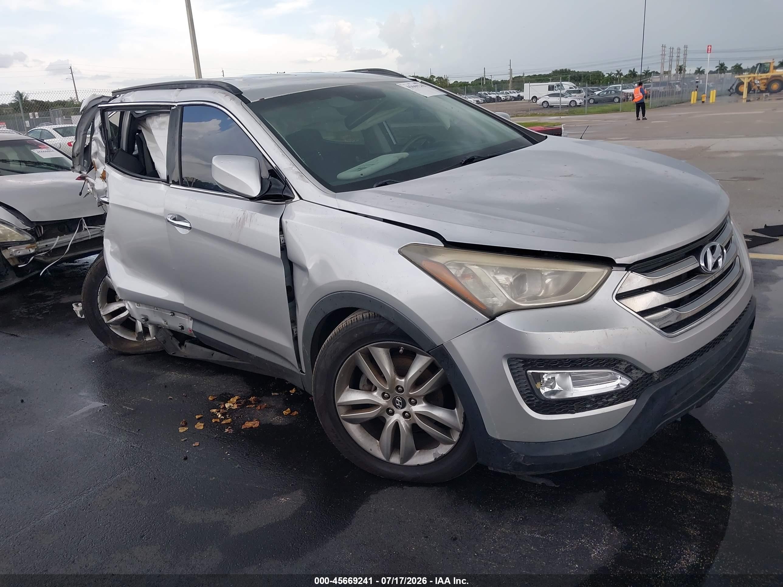 2013 Hyundai Santa Fe Sport, VIN 5XYZU3LA5DG035571 — Rear end
