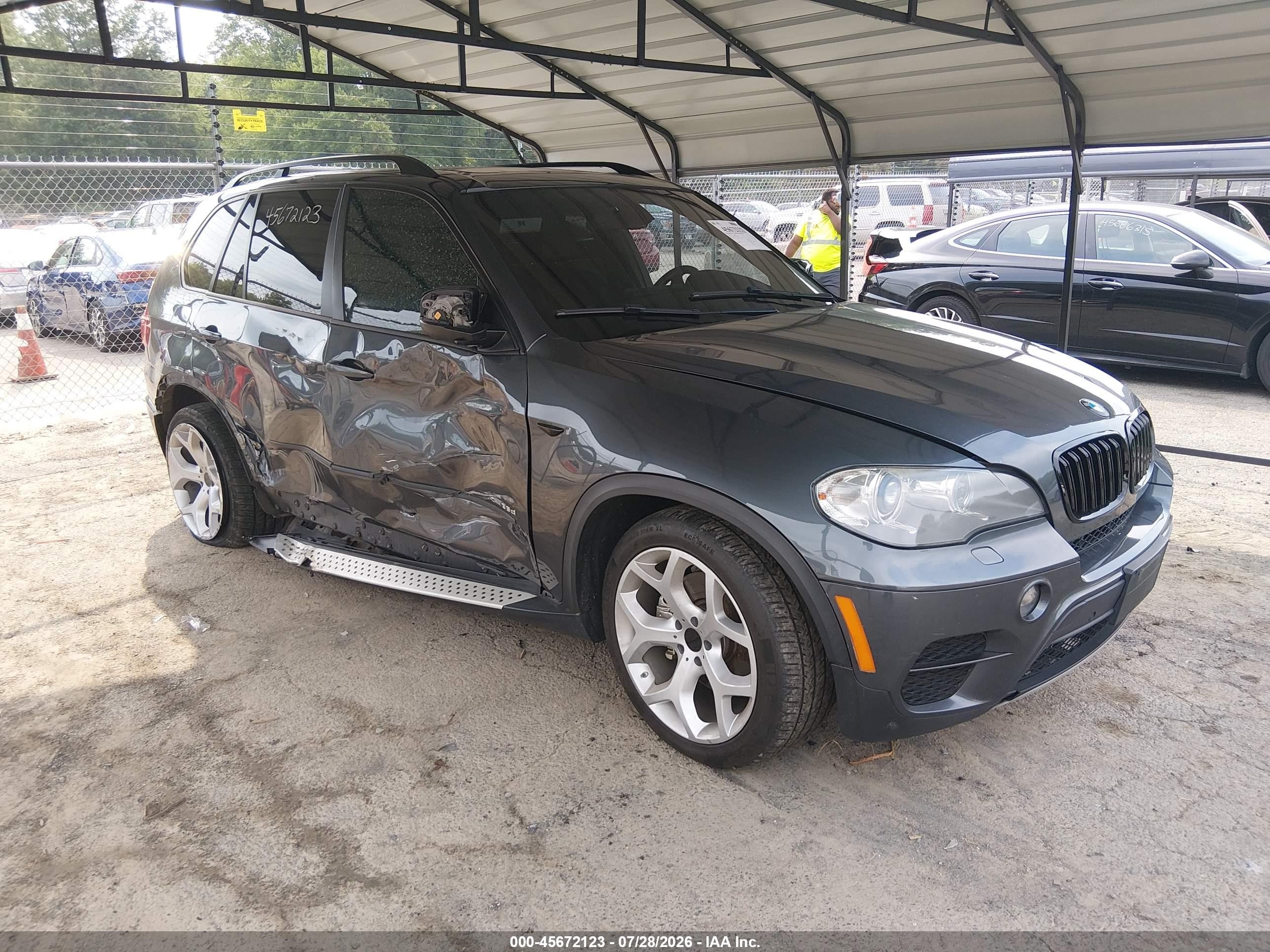 2012 BMW X5 35d, VIN 5UXZW0C55CL673638 — Бок