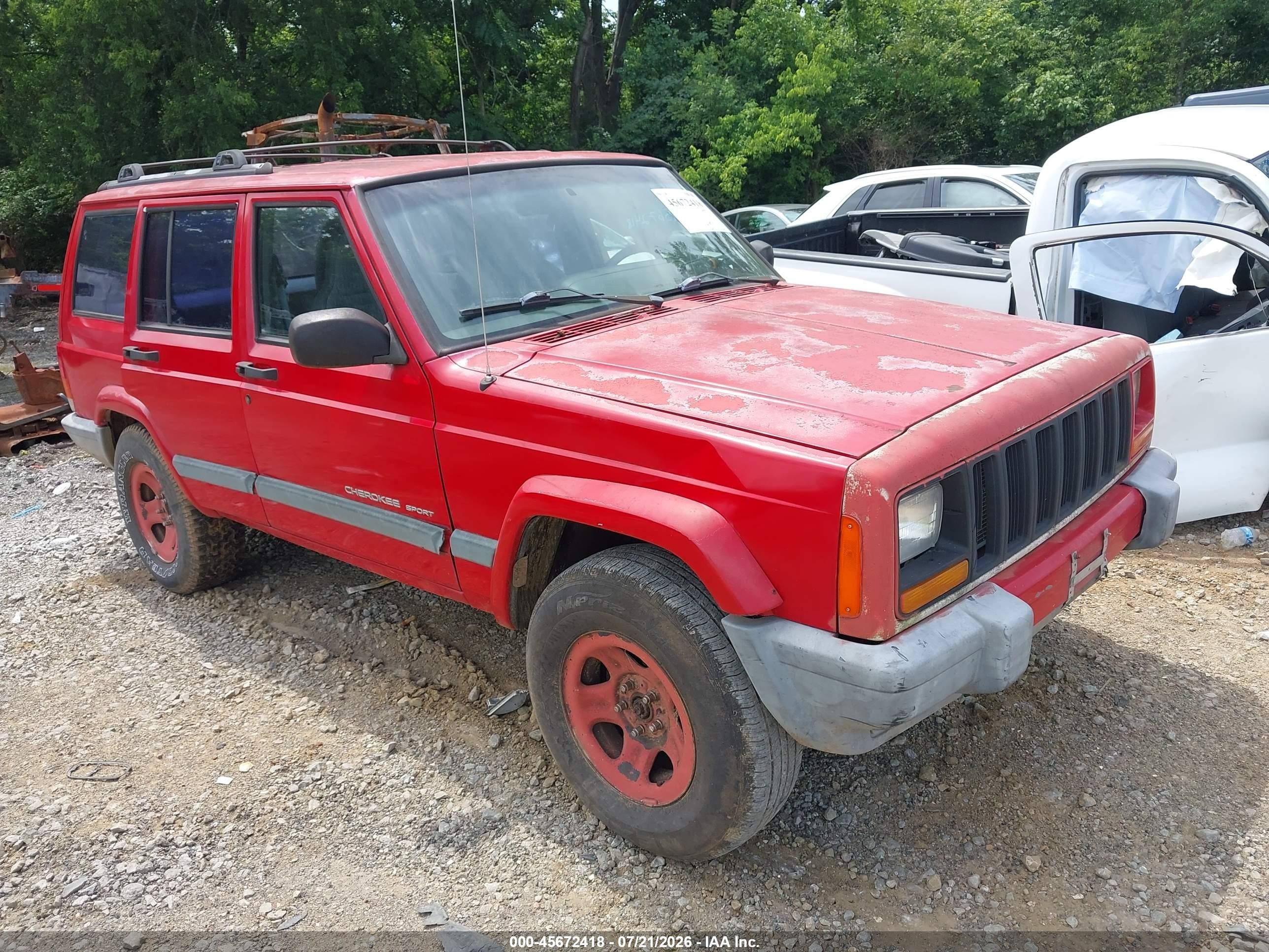 1999 Jeep Cherokee Sport, VIN 1J4FT68S4XL667084 — Normal wear
