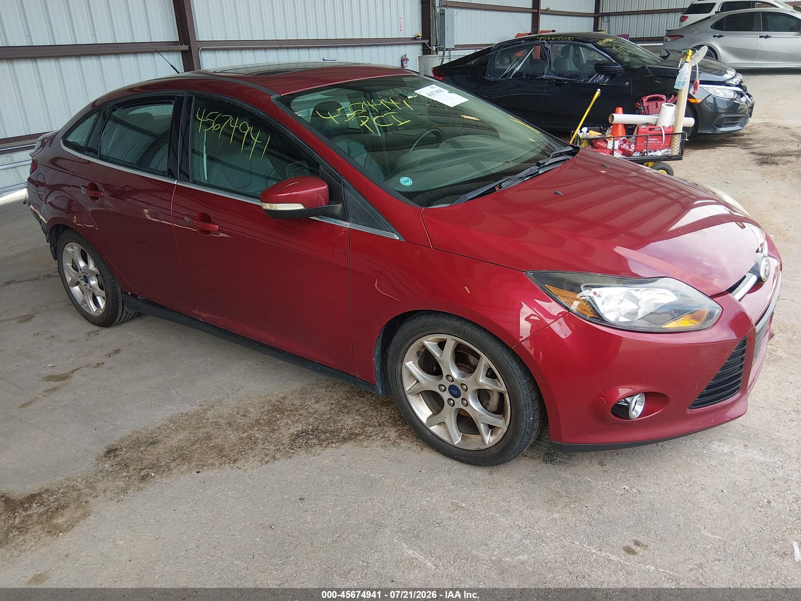 2014 Ford Focus Titanium, VIN 1FADP3J2XEL349368 — Rear end