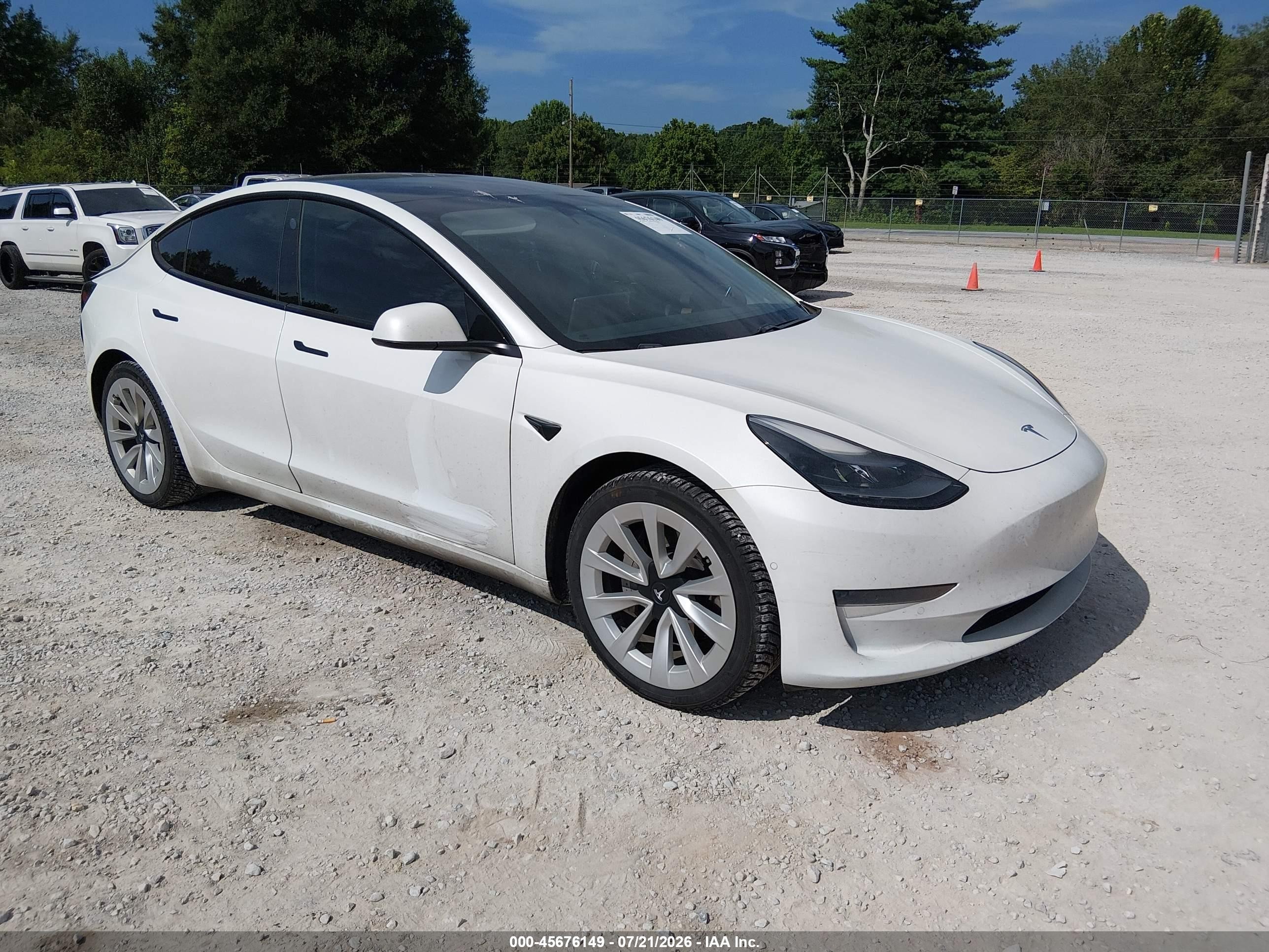 2021 Tesla Model 3 Standard Range Plus, VIN 5YJ3E1EAXMF048781 — Rear end