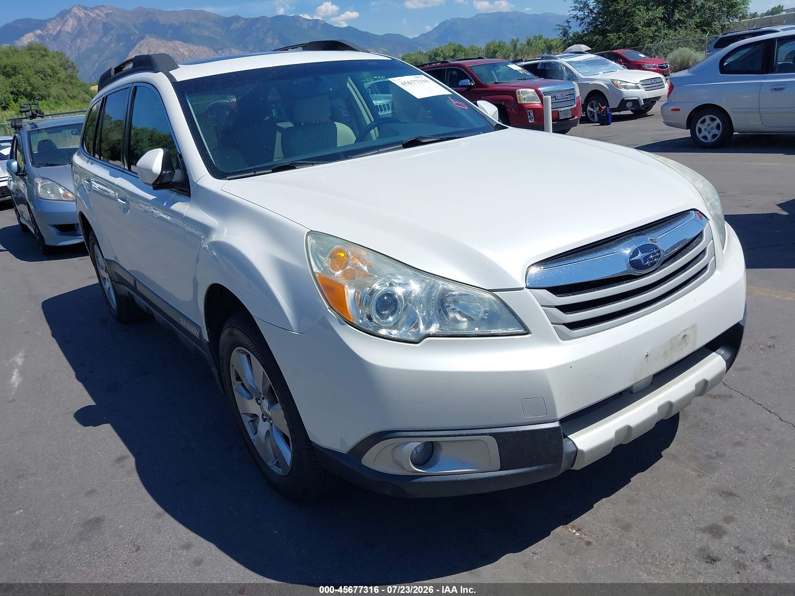 2011 Subaru Outback Limited Power Moon, VIN 4S4BRDKC4B2358752 — Side