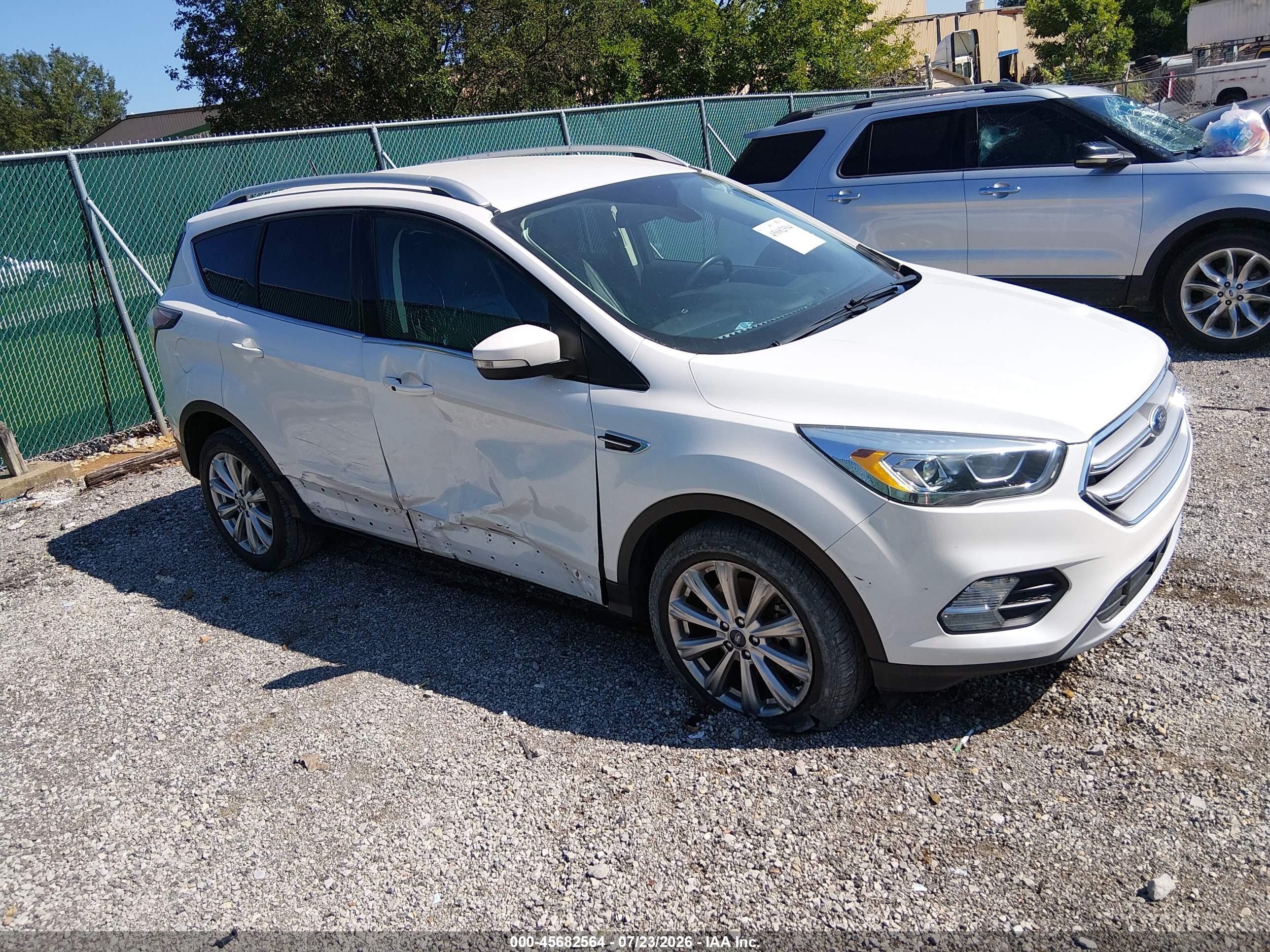 2017 Ford Escape Titanium, VIN 1FMCU0J98HUB40649 — Side