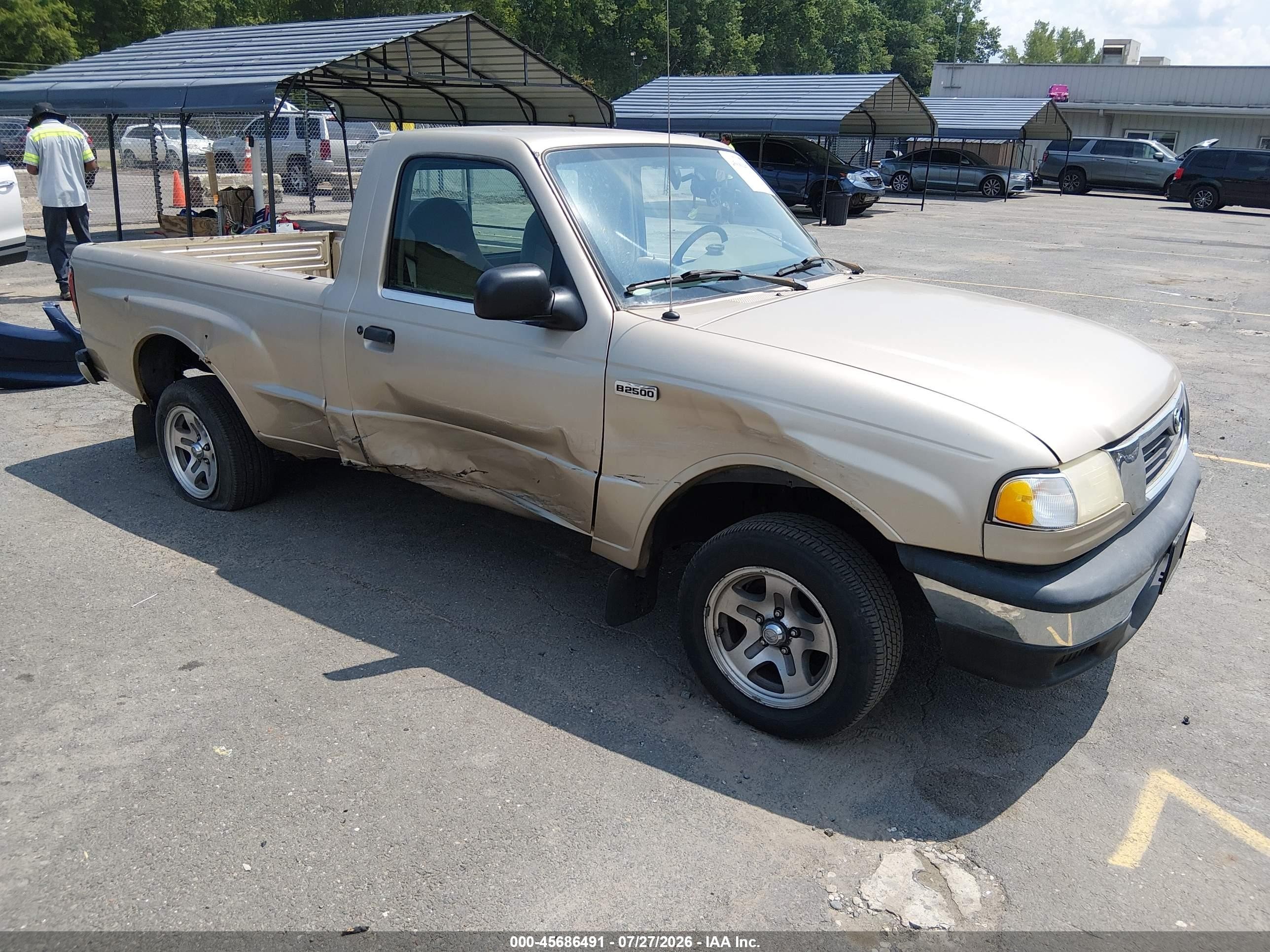 1999 Mazda B-Series SX, VIN 4F4YR12C8XTM47102 — Side