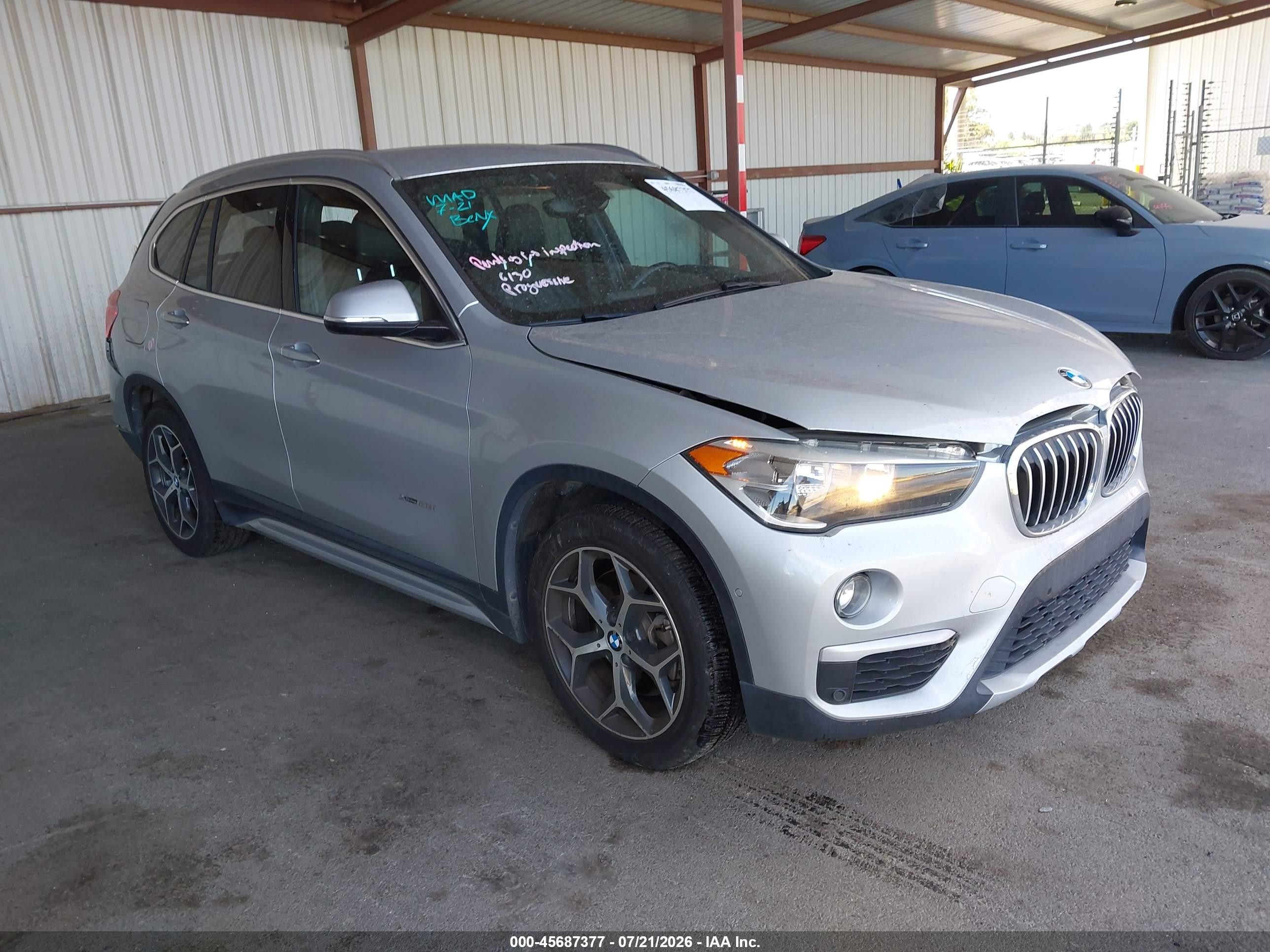 2017 BMW X1 xDrive28i, VIN WBXHT3C32H5F68434 — Зад