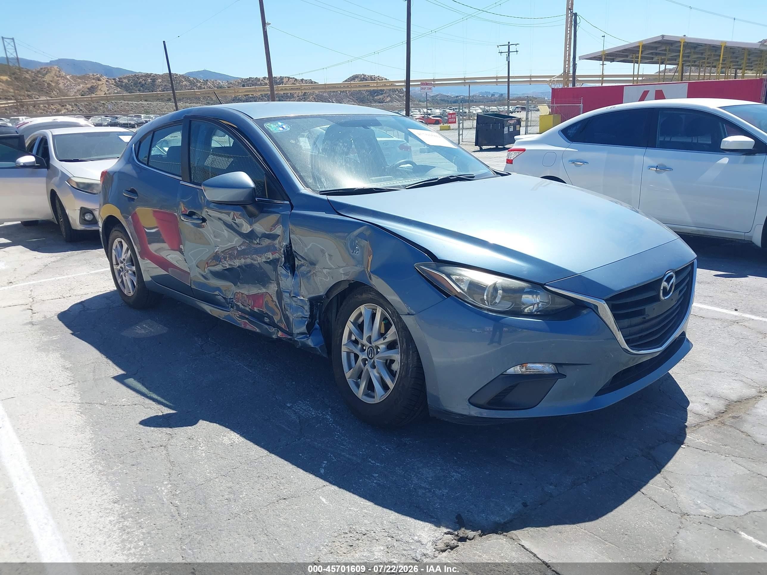 2014 Mazda 3 i Touring, VIN JM1BM1L75E1204757 — Бок
