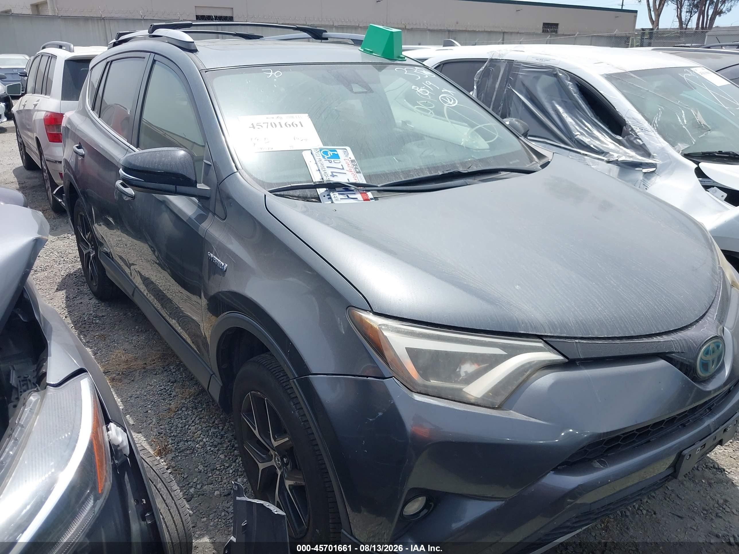 2018 Toyota RAV4 Hybrid SE, VIN JTMJJREV3JD173774 — Side