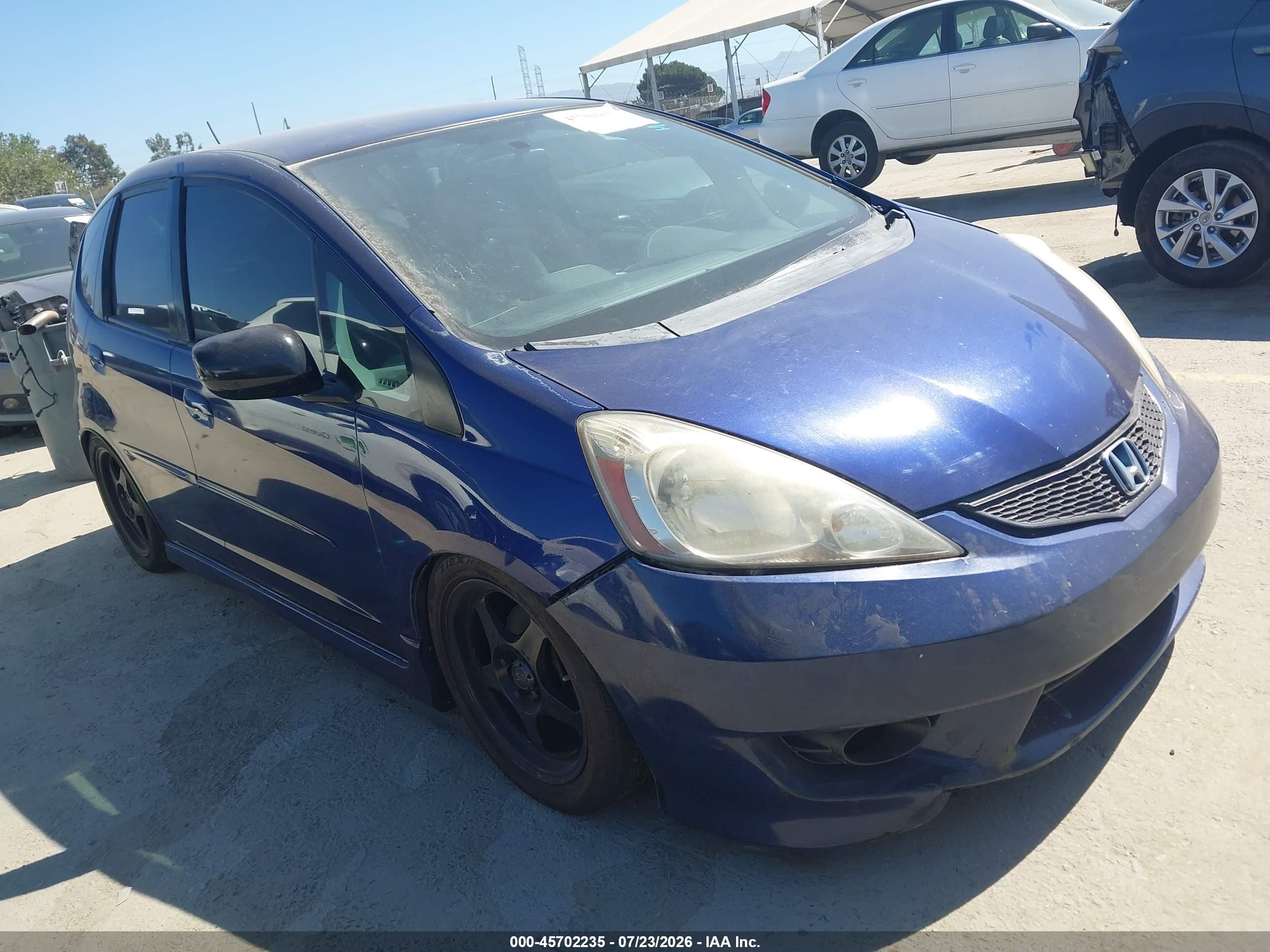 2011 Honda Fit Sport, VIN JHMGE8H54BC010450 — Бок